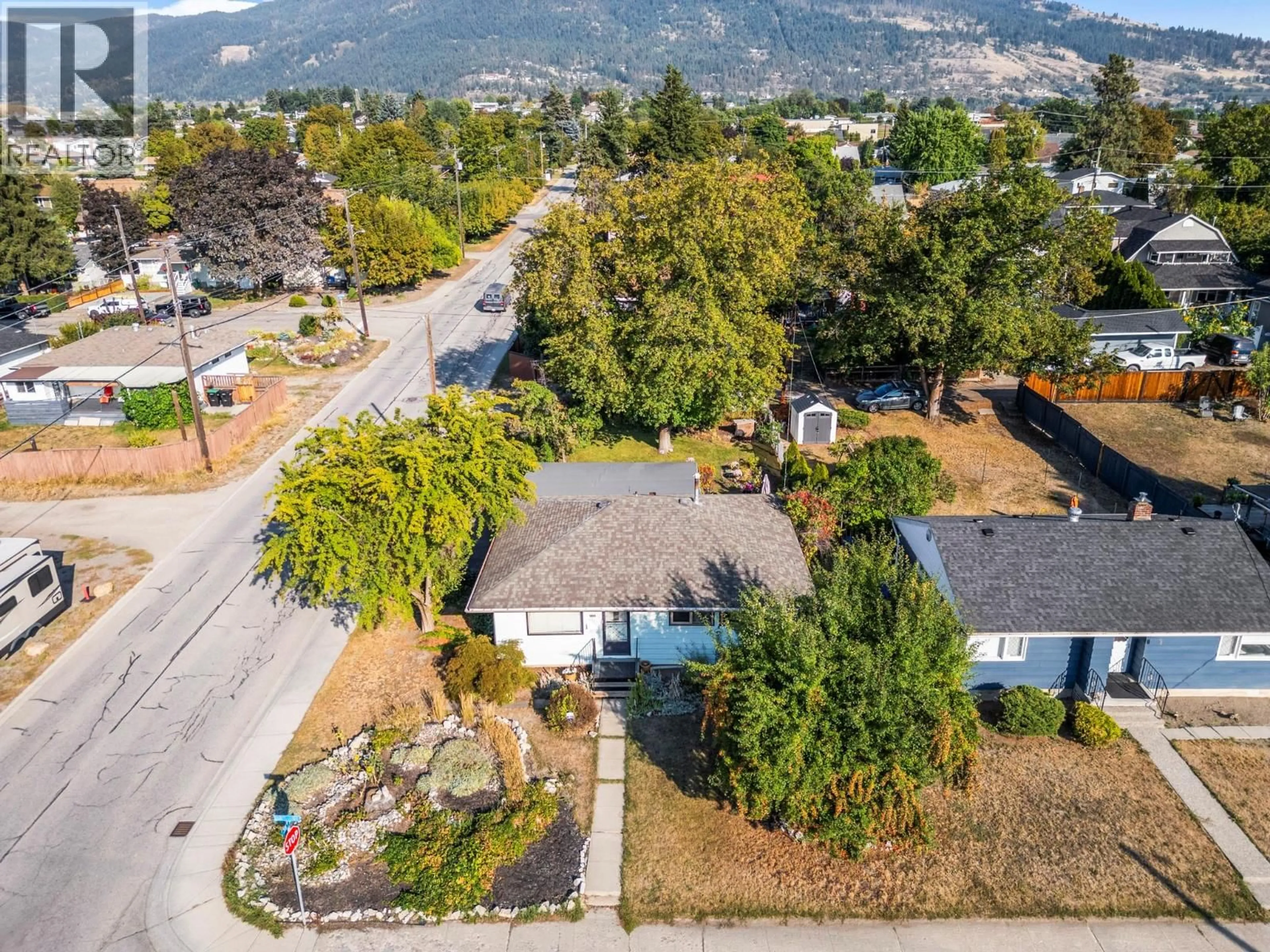 A pic from outside/outdoor area/front of a property/back of a property/a pic from drone, mountain view for 3405 18 STREET, Vernon British Columbia V1T4A8