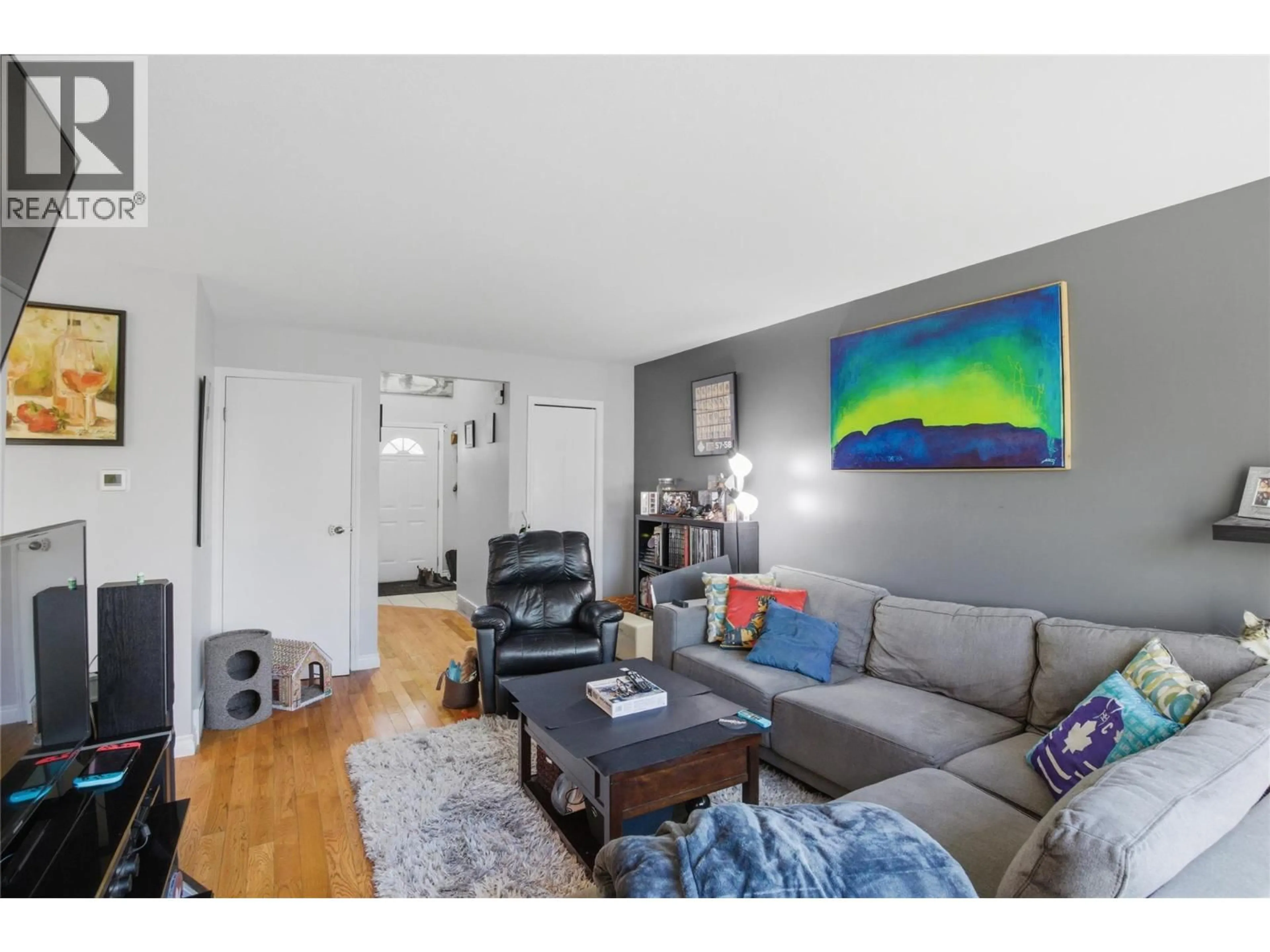 Living room with furniture, wood/laminate floor for 12 - 1750 MCKINLEY COURT, Kamloops British Columbia V2E2N6