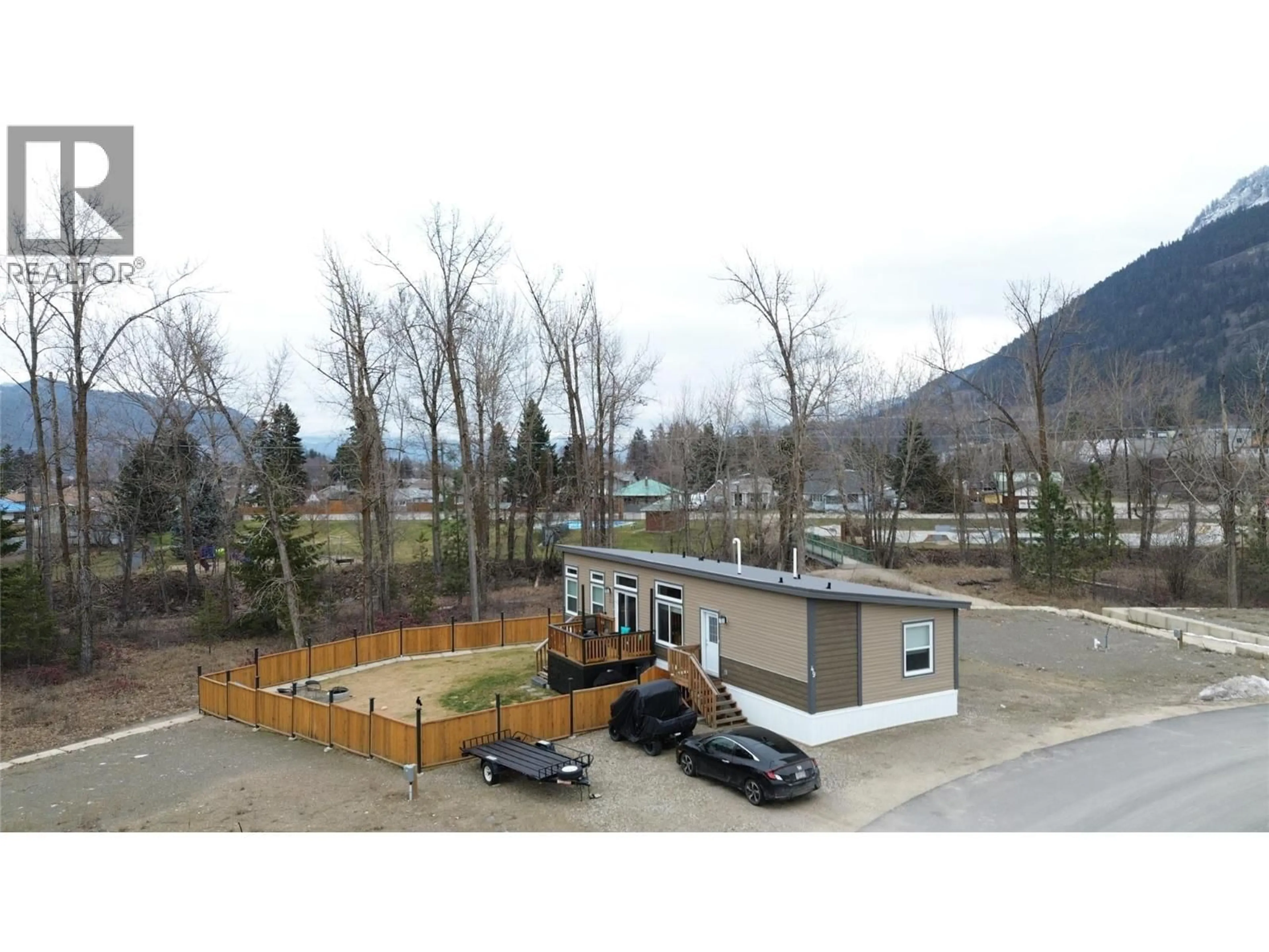 A pic from outside/outdoor area/front of a property/back of a property/a pic from drone, mountain view for 49 - 235 AYLMER ROAD, Chase British Columbia V0E1M1