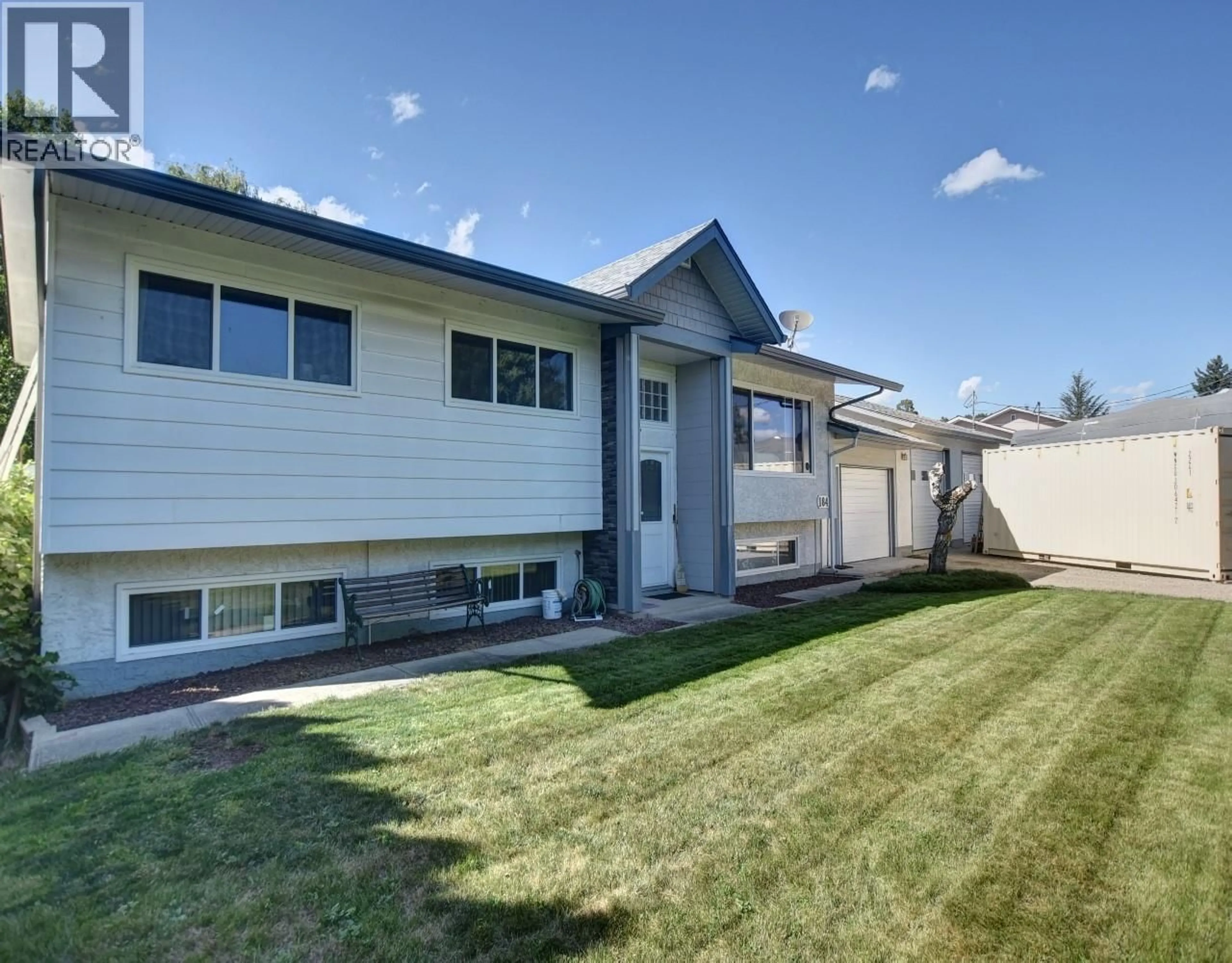 Home with vinyl exterior material, street for 184 CARIBOO ROAD, Kelowna British Columbia V1V2E4