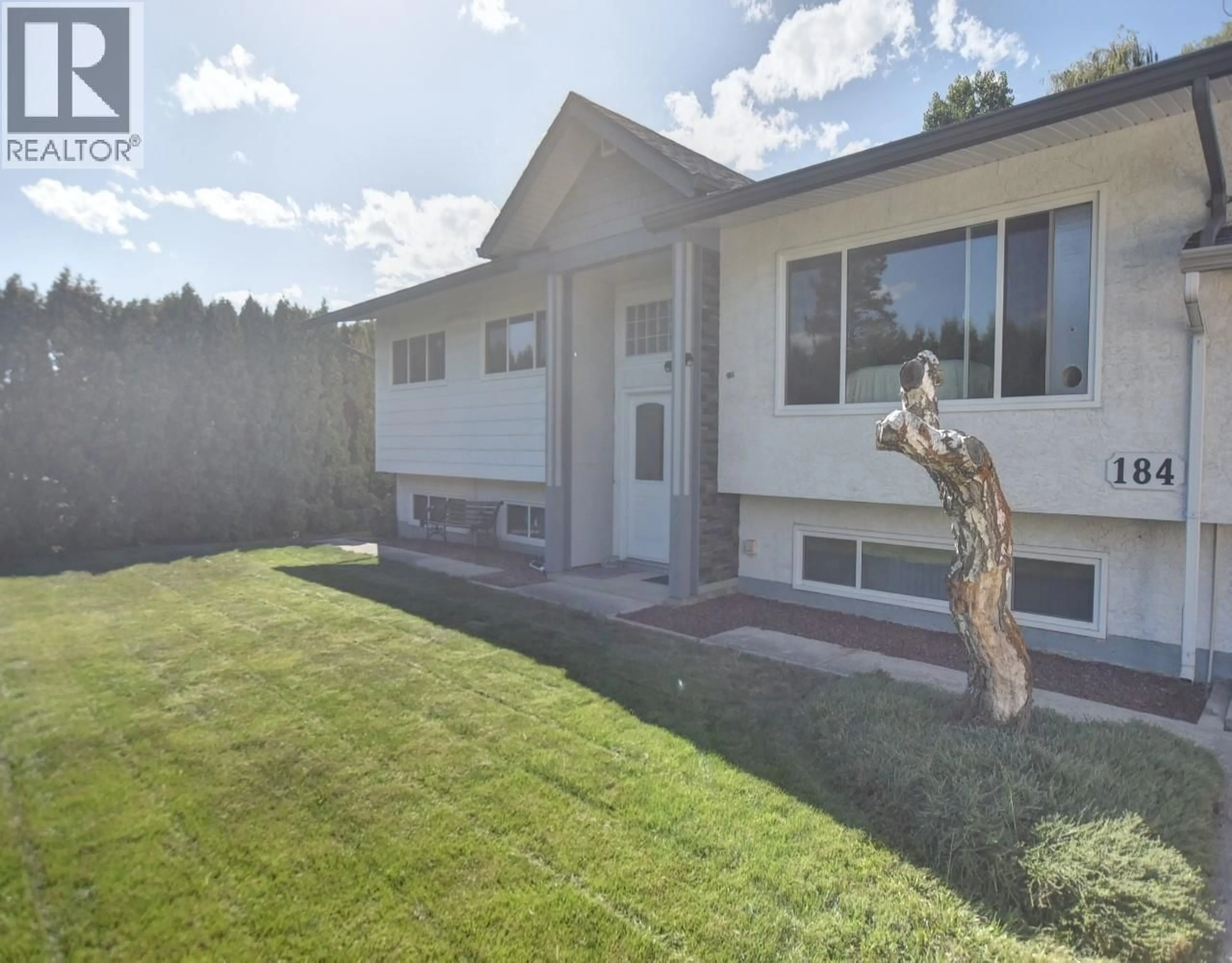 Home with vinyl exterior material, street for 184 CARIBOO ROAD, Kelowna British Columbia V1V2E4