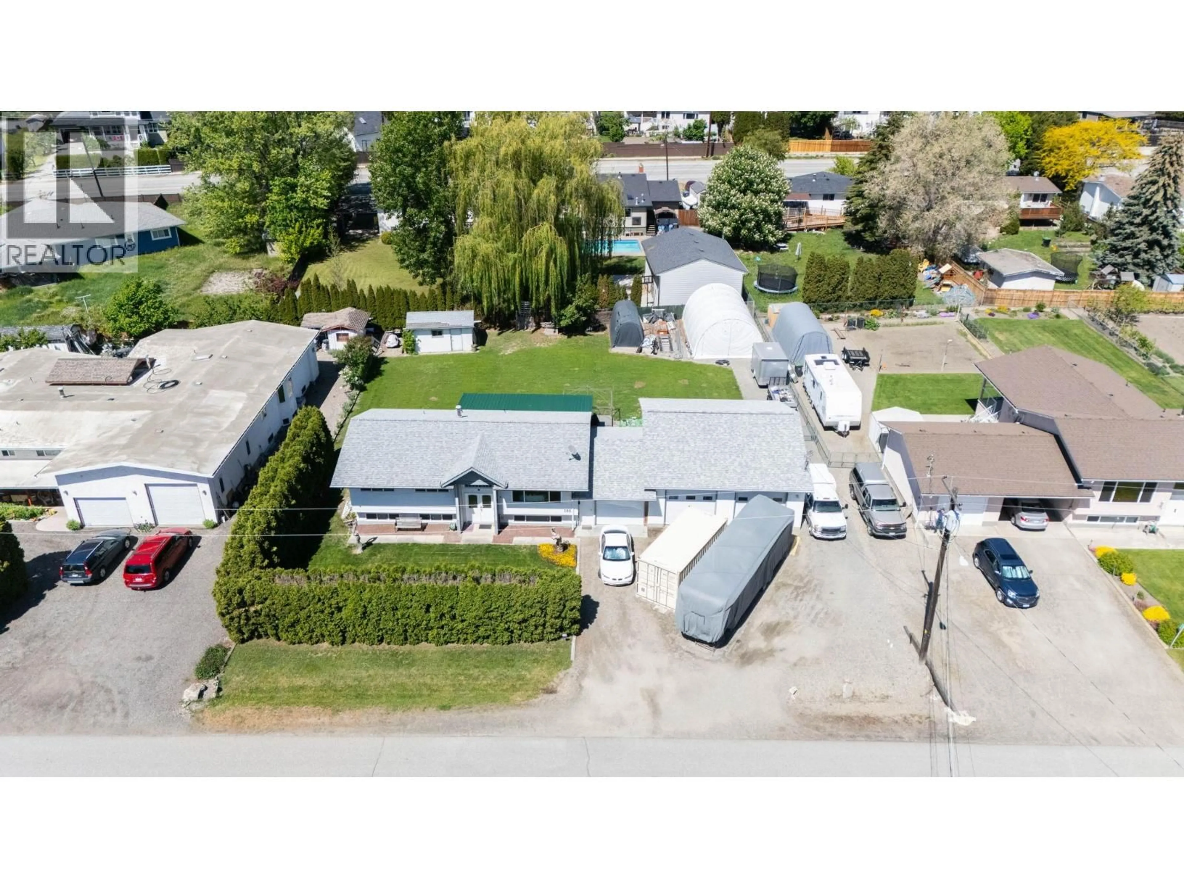 A pic from outside/outdoor area/front of a property/back of a property/a pic from drone, street for 184 CARIBOO ROAD, Kelowna British Columbia V1V2E4