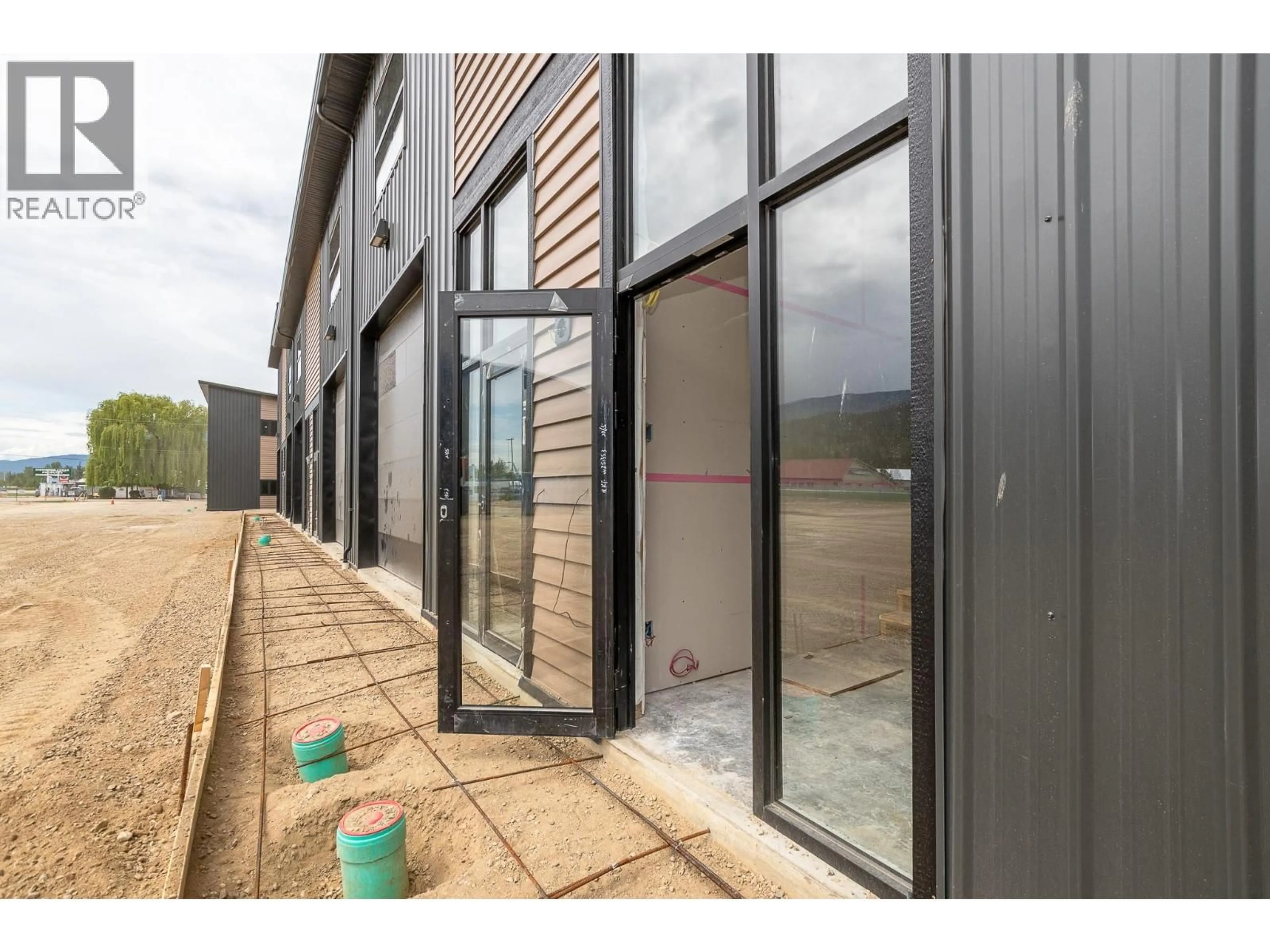 A pic from outside/outdoor area/front of a property/back of a property/a pic from drone, building for 10 - 1002 SEED FRONTAGE ROAD, Sicamous British Columbia V0E2V4