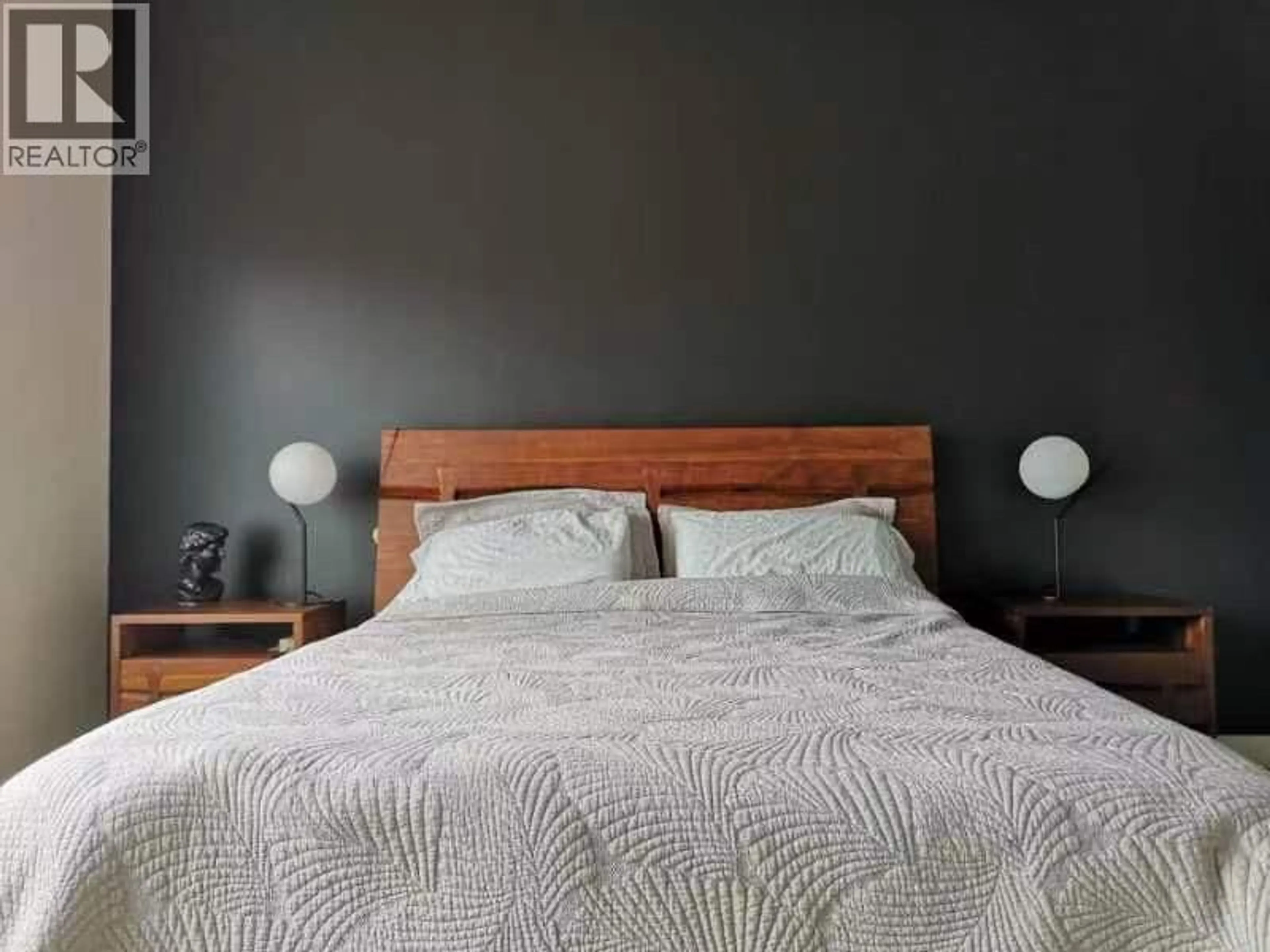 Bedroom with bed, wood/laminate floor for 1243 FEEDHAM AVENUE, Kelowna British Columbia V1P1P5