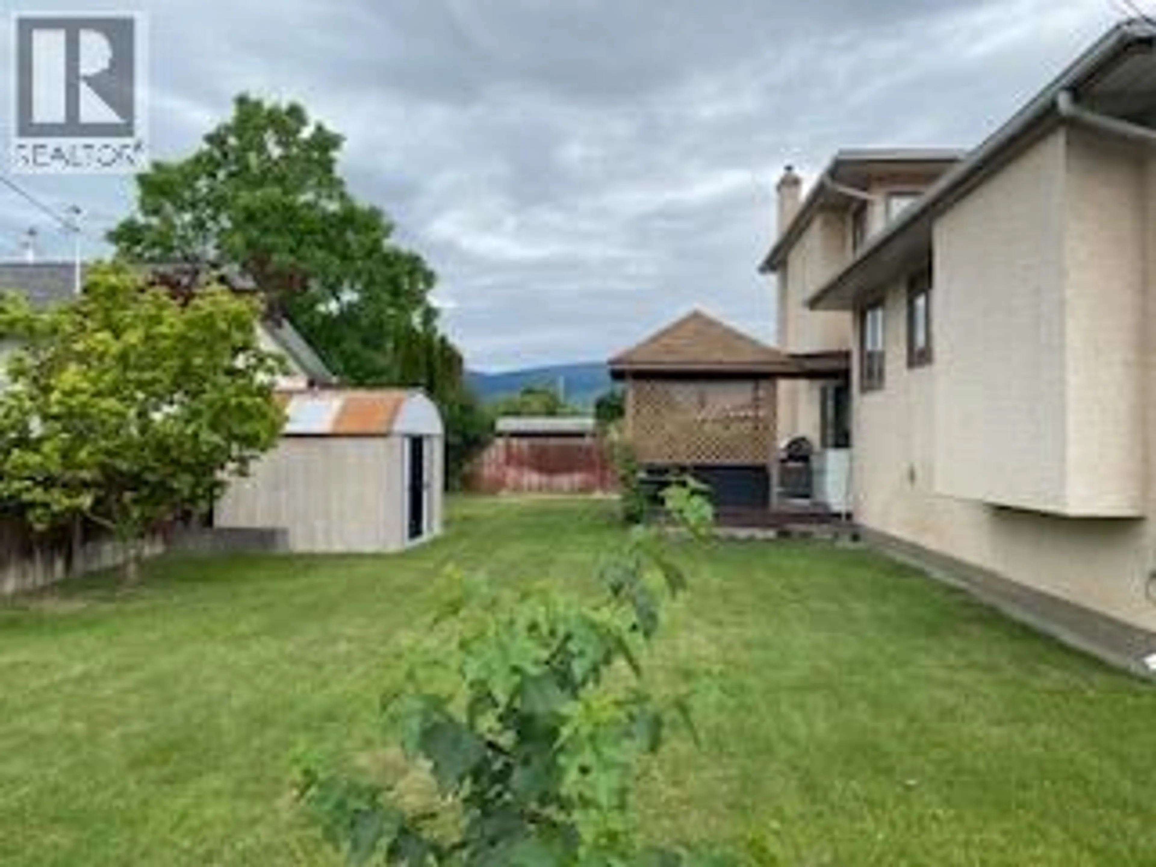 A pic from outside/outdoor area/front of a property/back of a property/a pic from drone, mountain view for 3343 GORDON DRIVE, Kelowna British Columbia V1W3M9