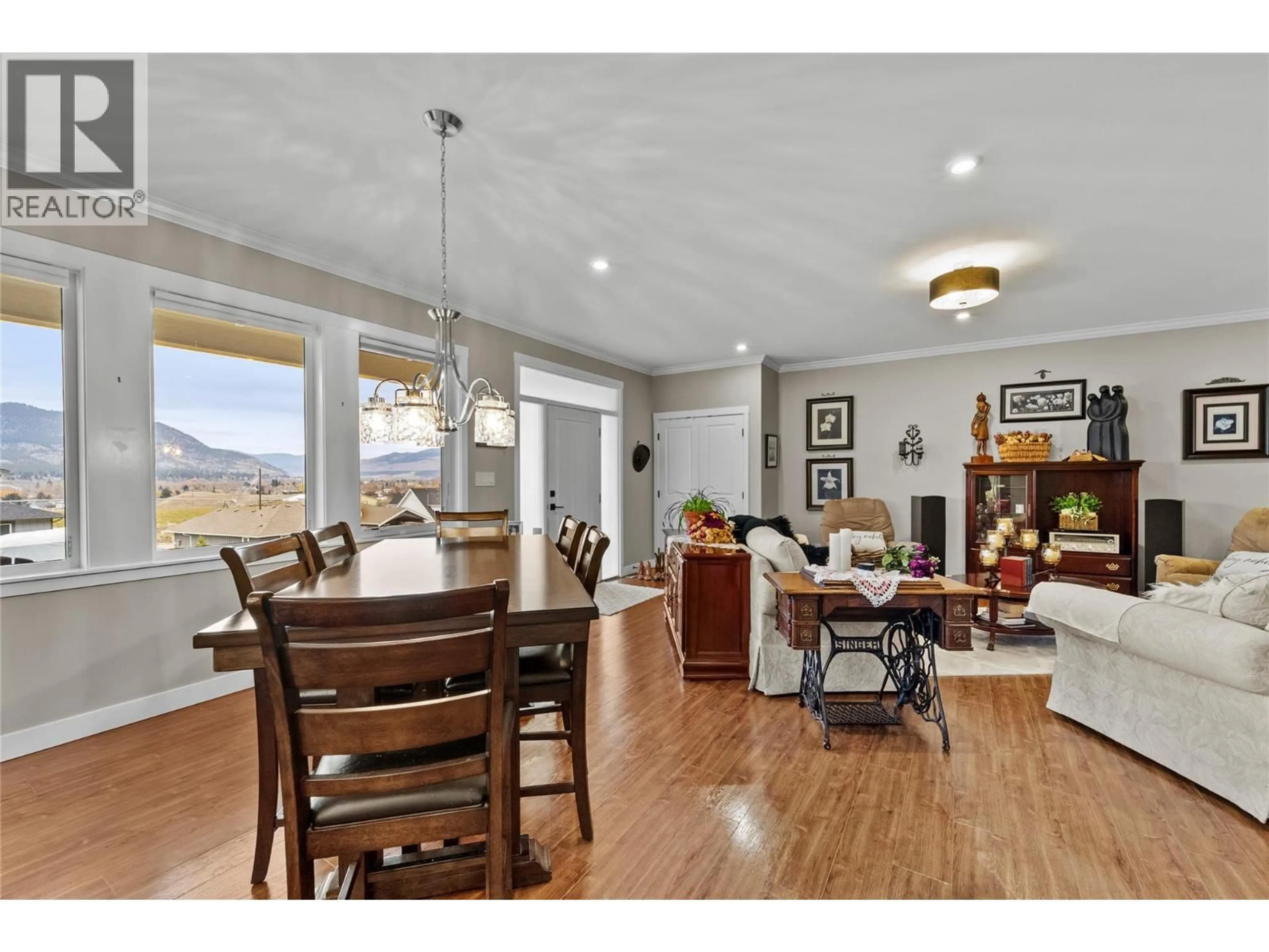 Open concept kitchen, wood/laminate floor for 370 LOGAN LANE, Merritt British Columbia V1K0B5