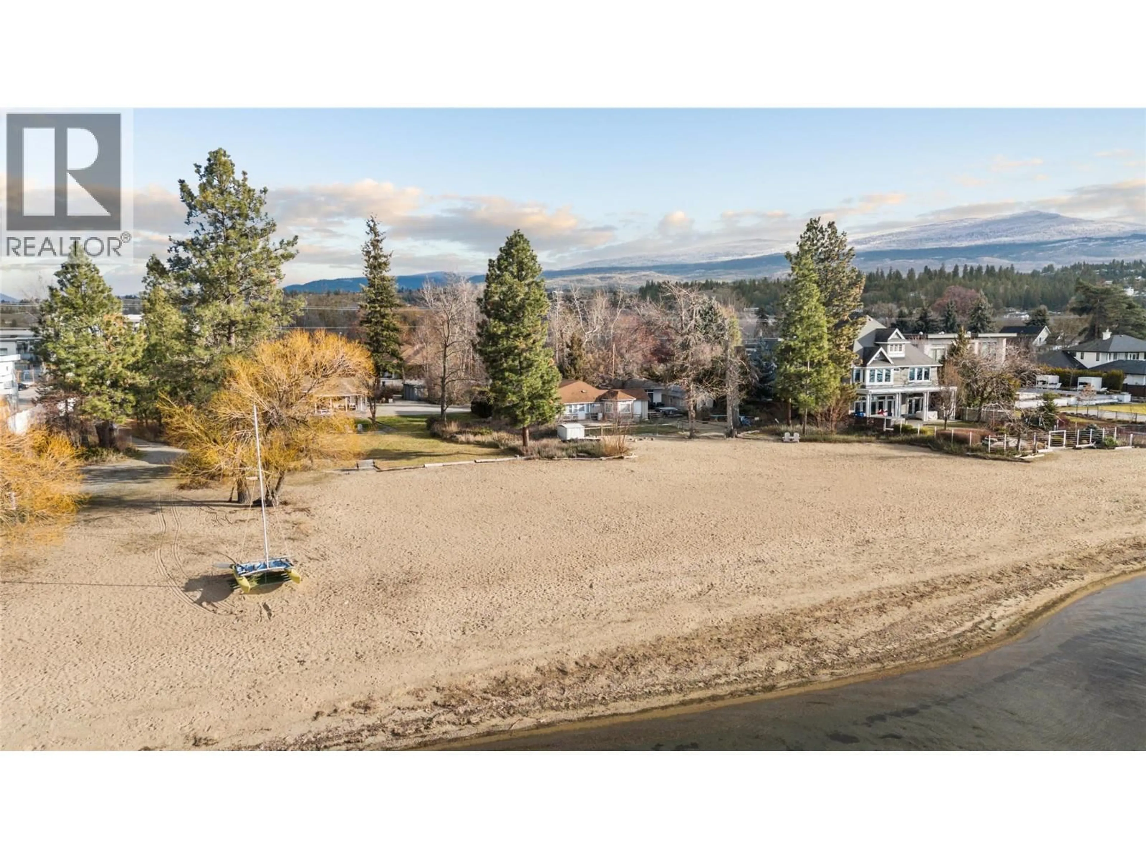 A pic from outside/outdoor area/front of a property/back of a property/a pic from drone, water/lake/river/ocean view for 4164 LAKESHORE ROAD, Kelowna British Columbia V1W1V9