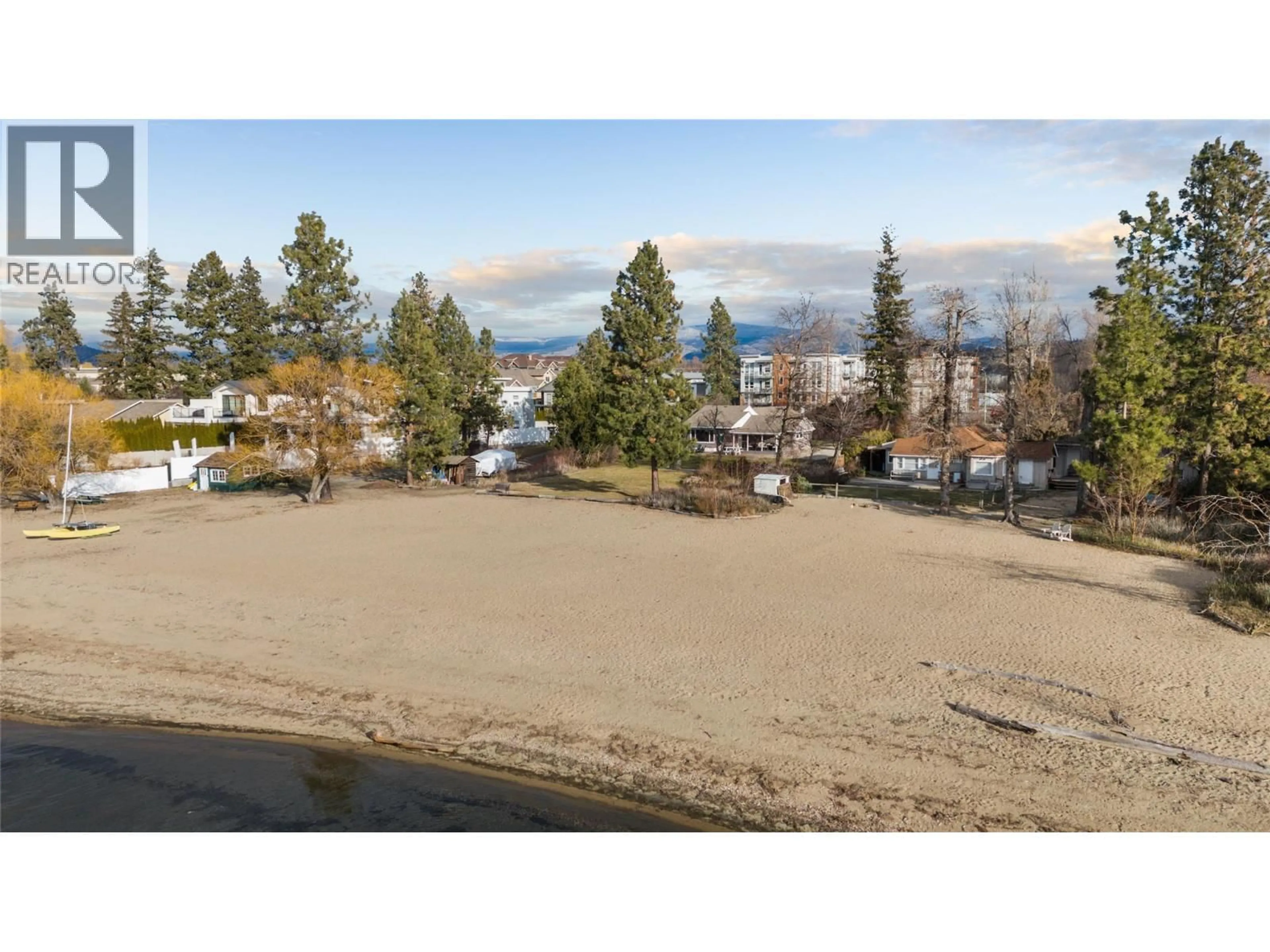 A pic from outside/outdoor area/front of a property/back of a property/a pic from drone, water/lake/river/ocean view for 4164 LAKESHORE ROAD, Kelowna British Columbia V1W1V9