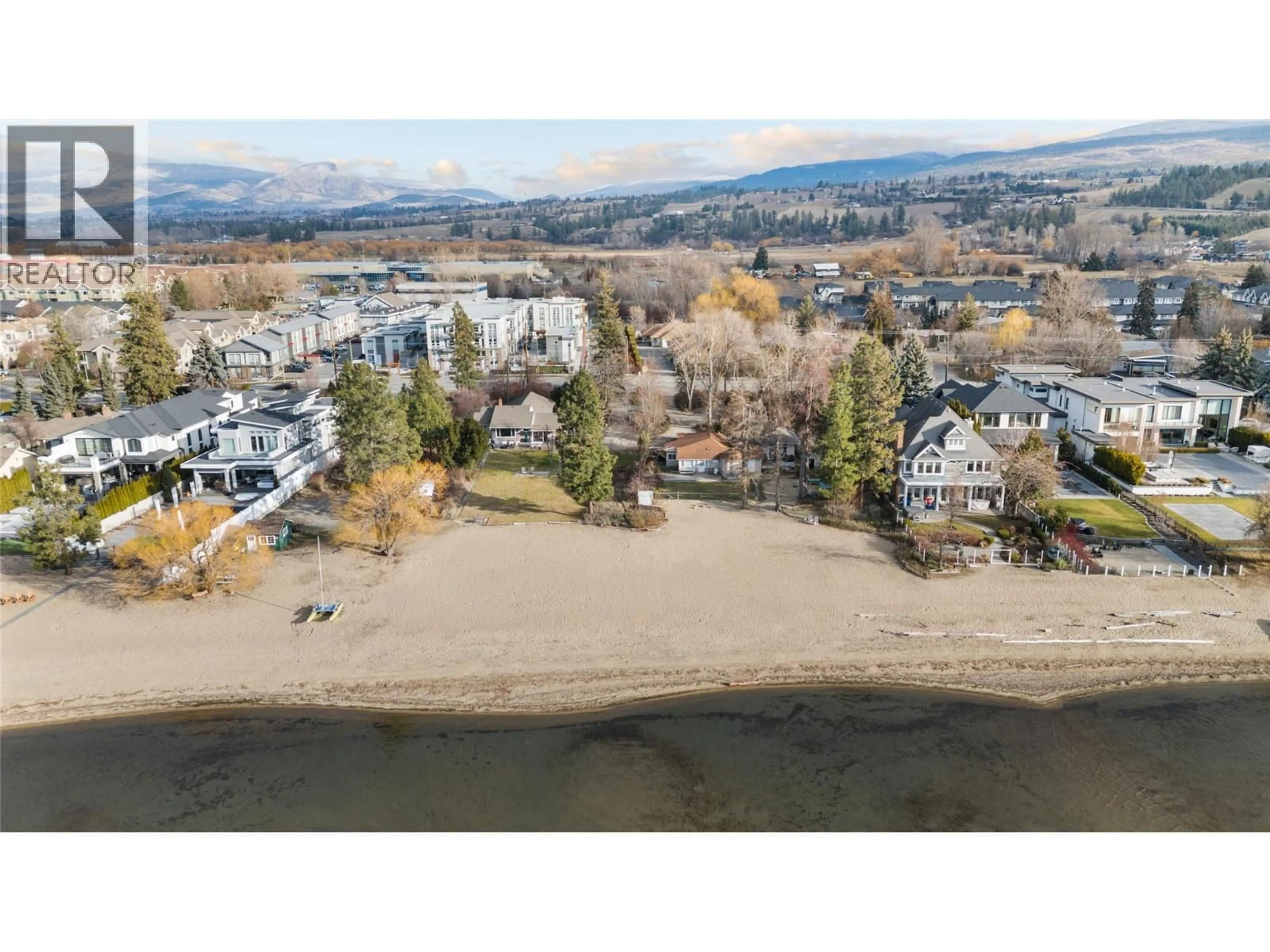 A pic from outside/outdoor area/front of a property/back of a property/a pic from drone, water/lake/river/ocean view for 4164 LAKESHORE ROAD, Kelowna British Columbia V1W1V9