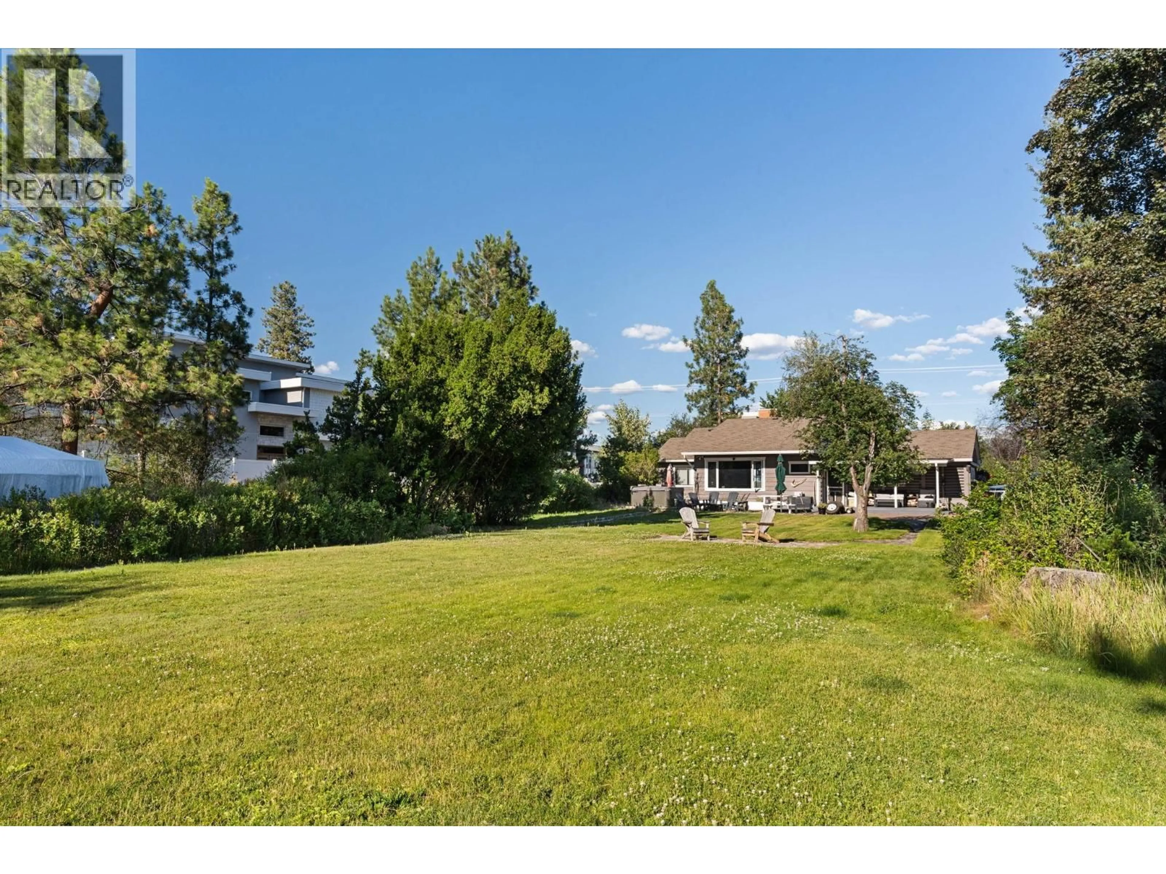 A pic from outside/outdoor area/front of a property/back of a property/a pic from drone, water/lake/river/ocean view for 4158 LAKESHORE ROAD, Kelowna British Columbia V1W1V9