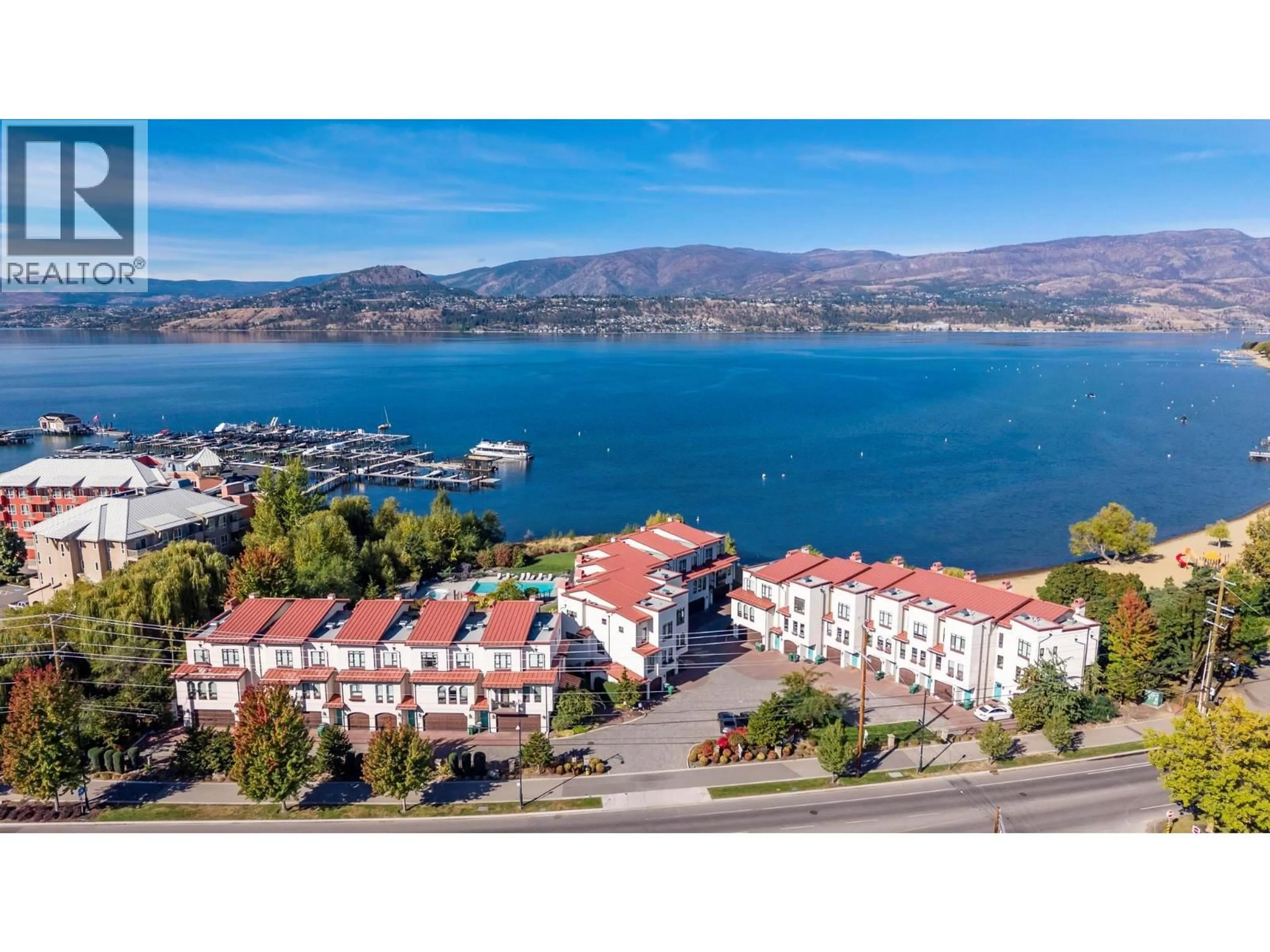 A pic from outside/outdoor area/front of a property/back of a property/a pic from drone, water/lake/river/ocean view for 13 - 3756 LAKESHORE ROAD, Kelowna British Columbia V1W3L4