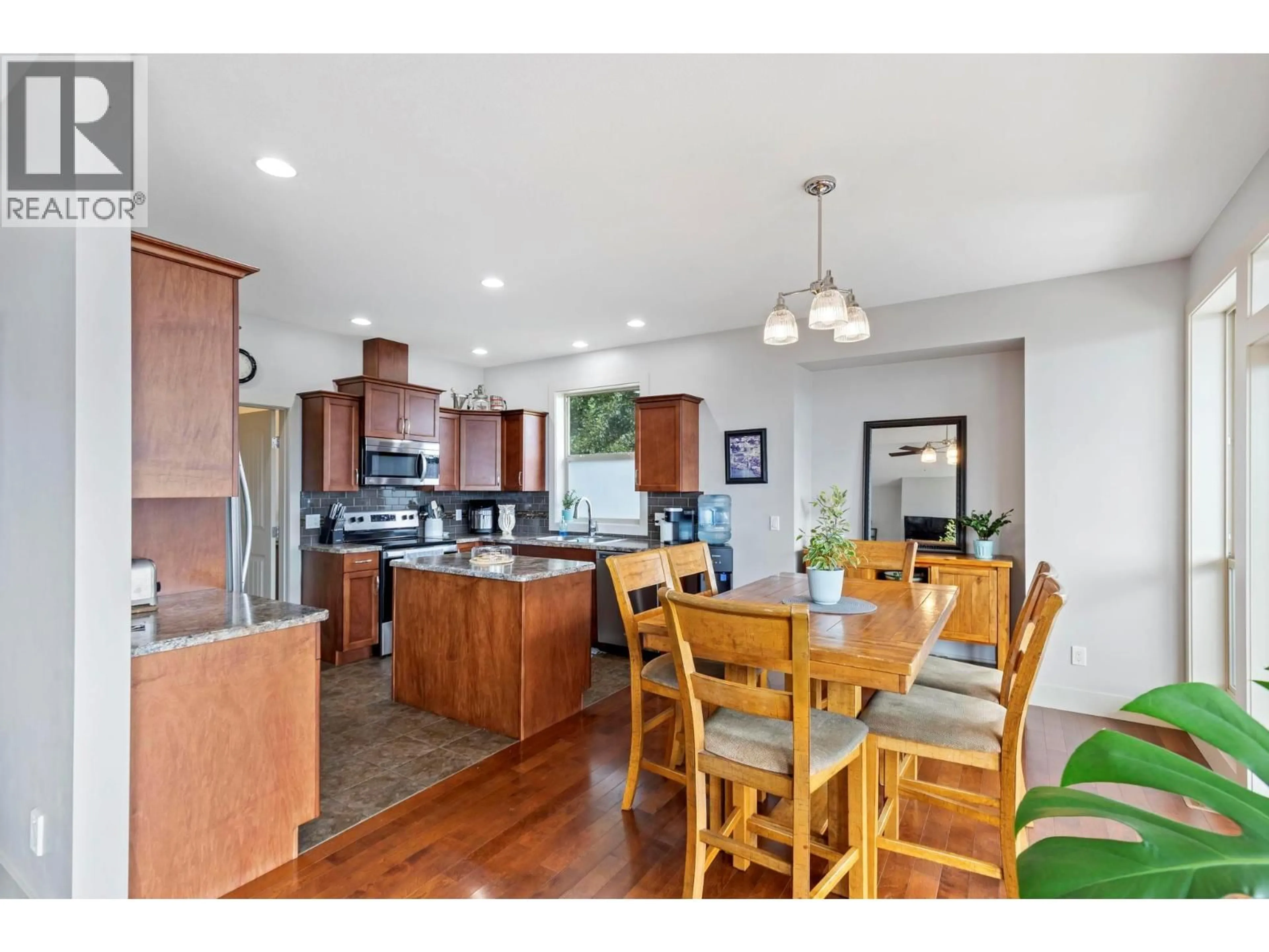 Open concept kitchen, wood/laminate floor for 2969 ENSIGN LANE, West Kelowna British Columbia V4T2Z4