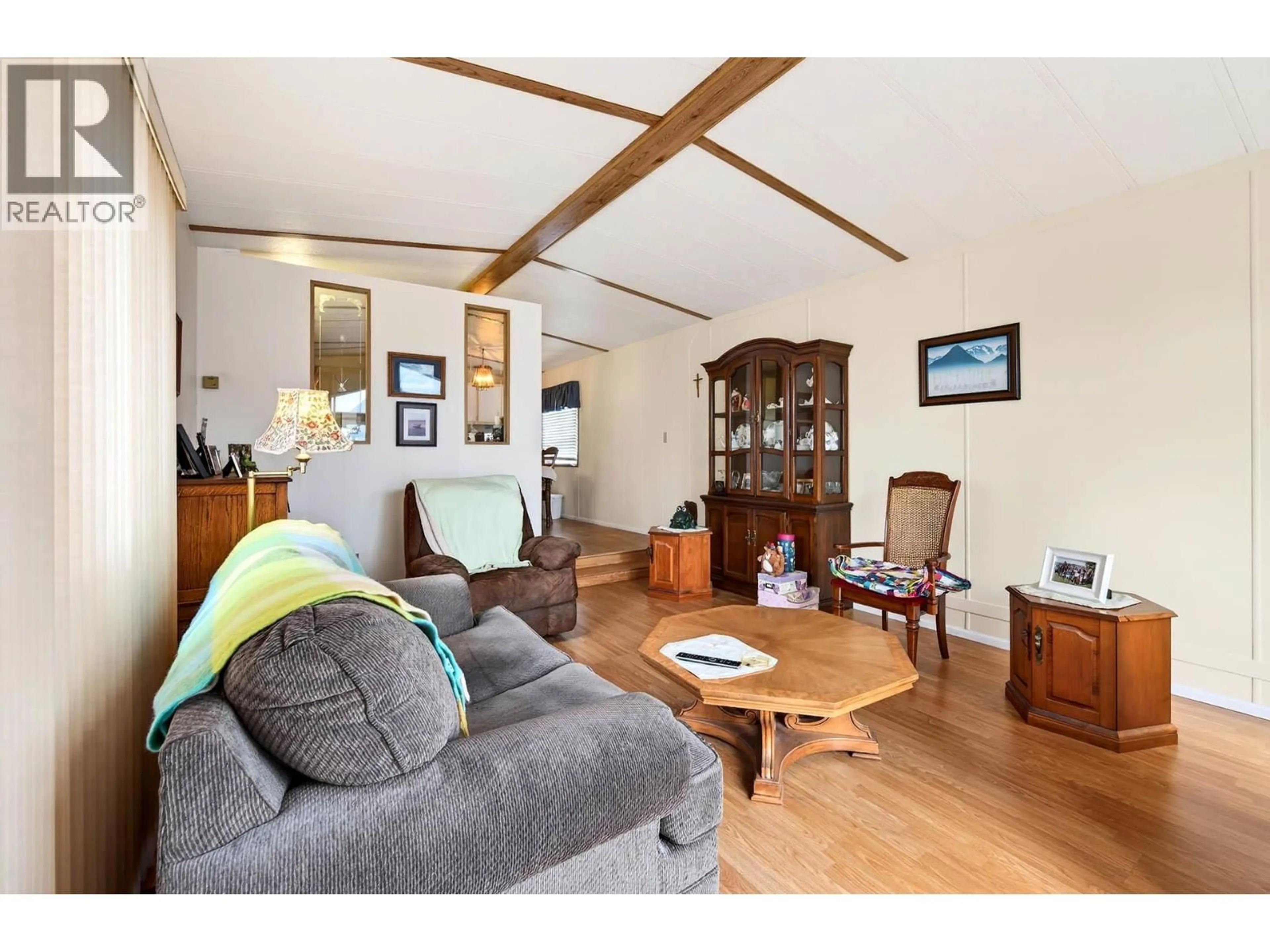 Living room with furniture, wood/laminate floor for 42 - 1720 WESTSYDE ROAD, Kamloops British Columbia V2B7B7