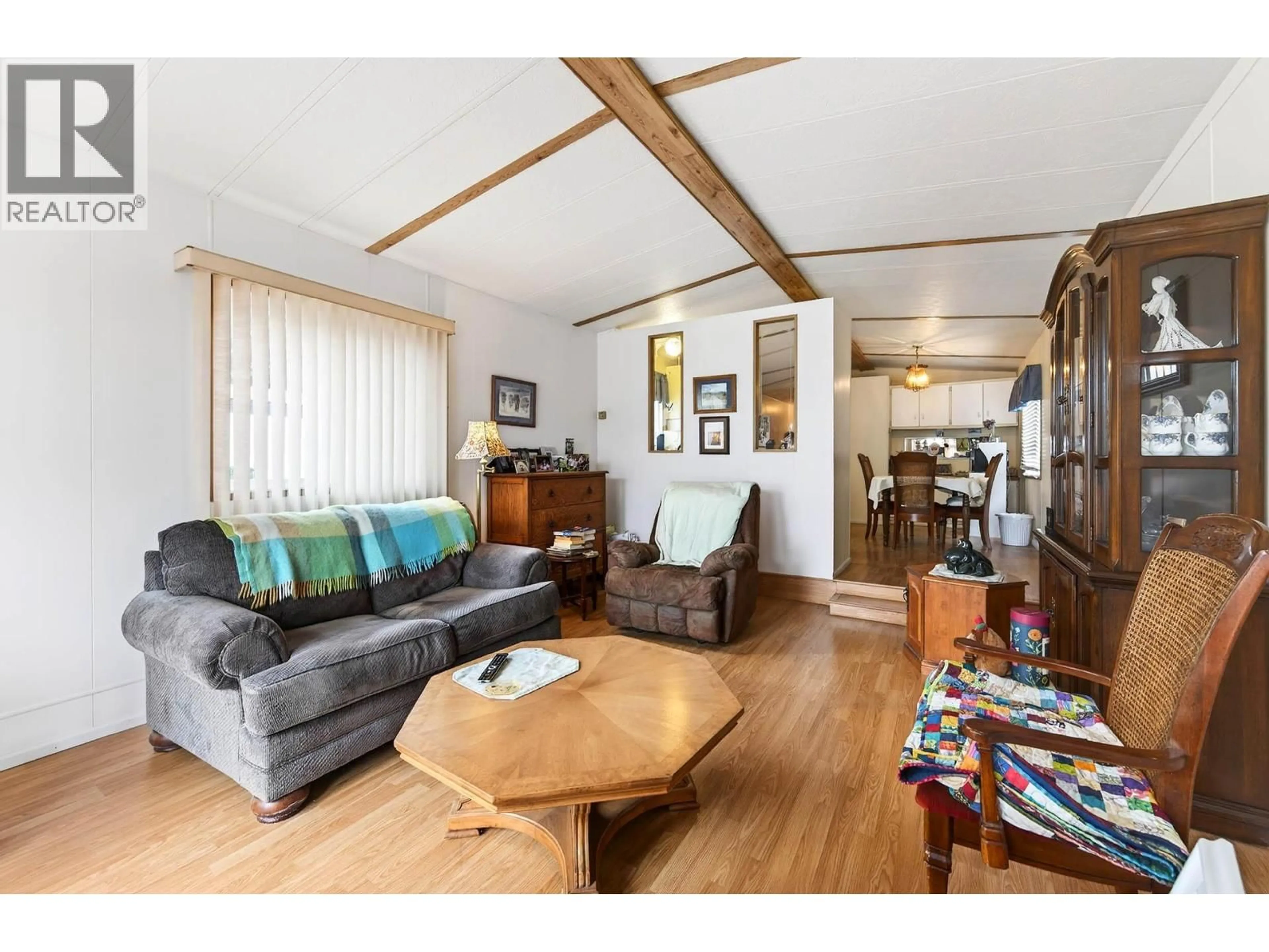 Living room with furniture, wood/laminate floor for 42 - 1720 WESTSYDE ROAD, Kamloops British Columbia V2B7B7