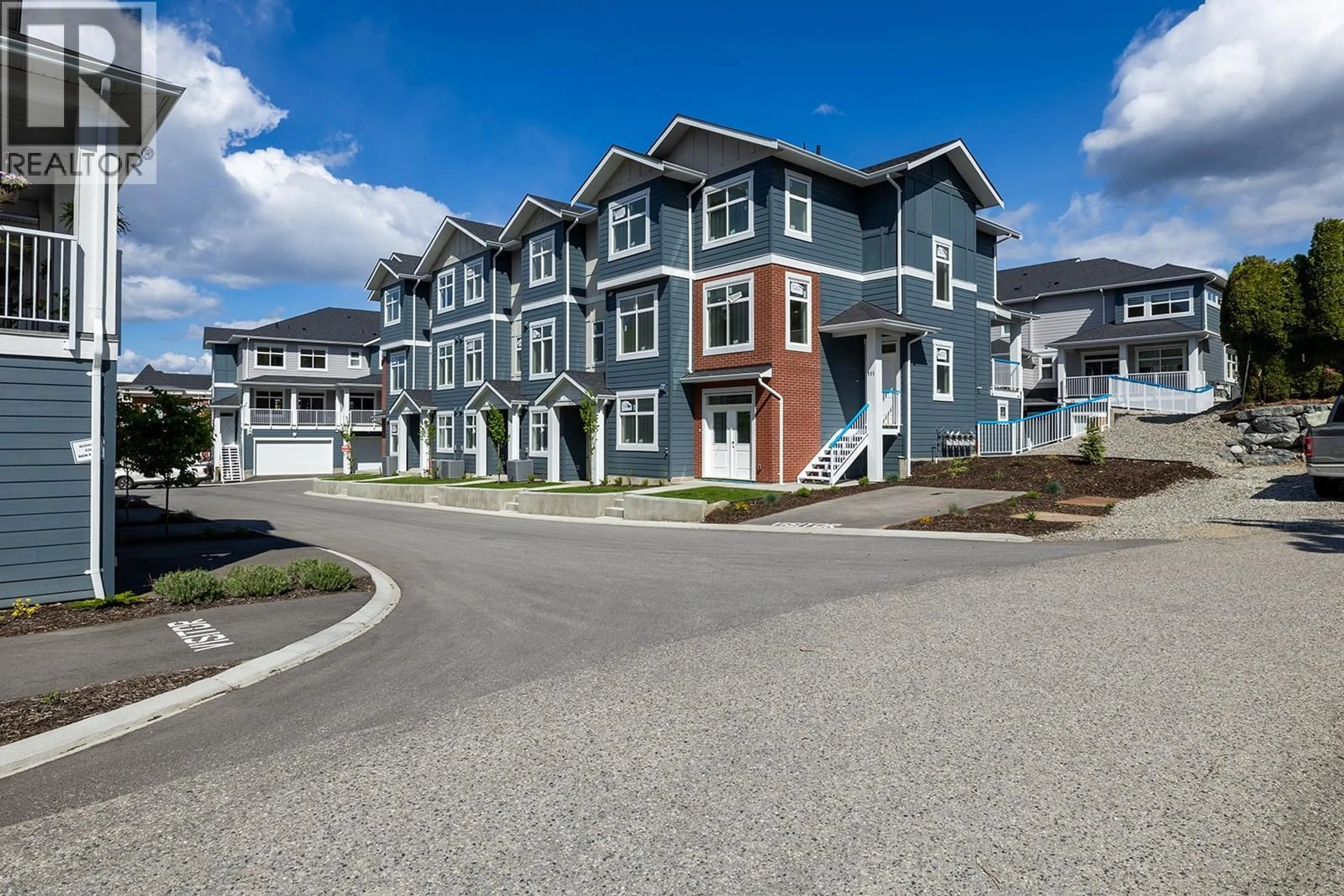 A pic from outside/outdoor area/front of a property/back of a property/a pic from drone, street for 114 - 5300 MAIN STREET, Kelowna British Columbia V1W0C1