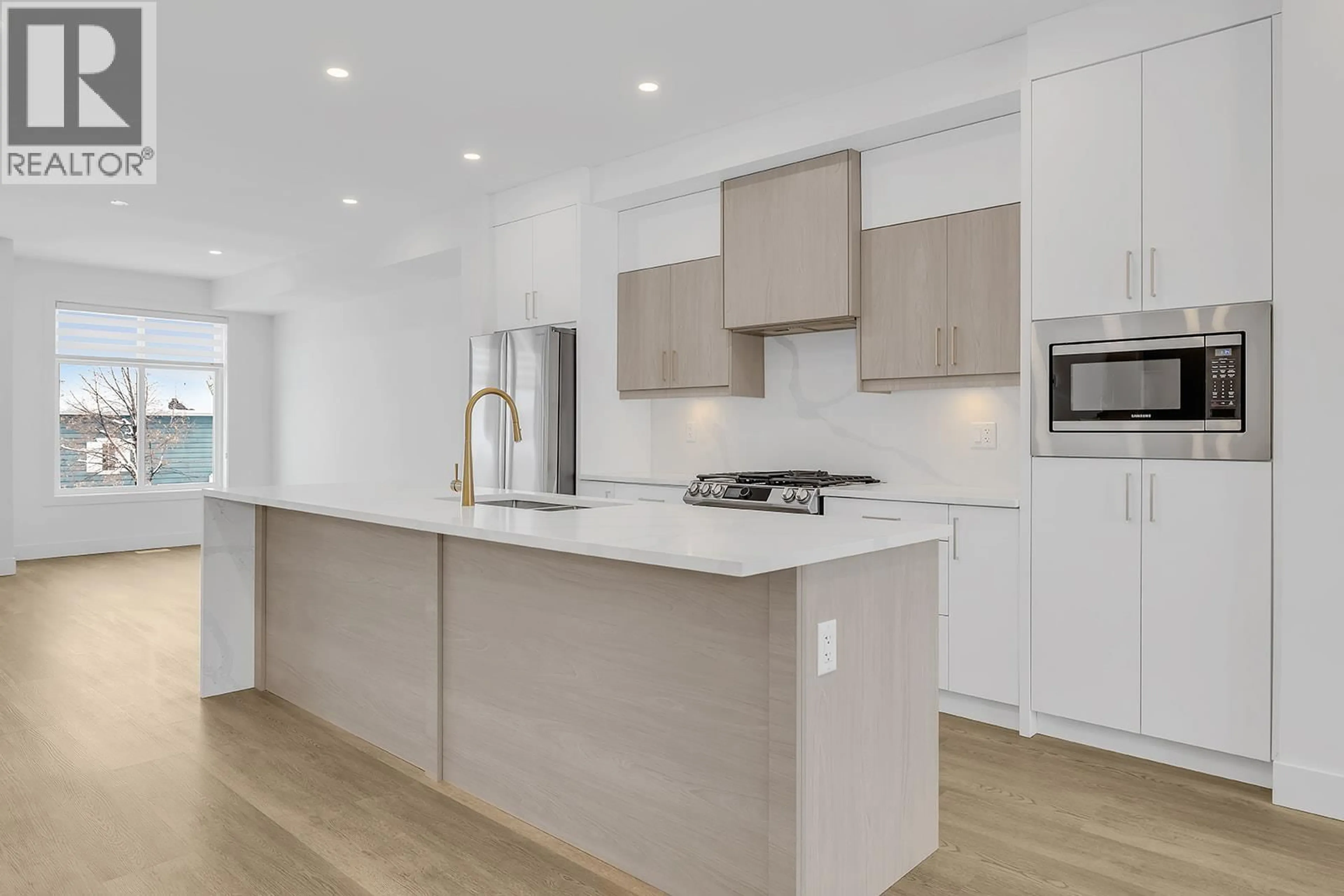 Contemporary kitchen, wood/laminate floor for 114 - 5300 MAIN STREET, Kelowna British Columbia V1W0C1