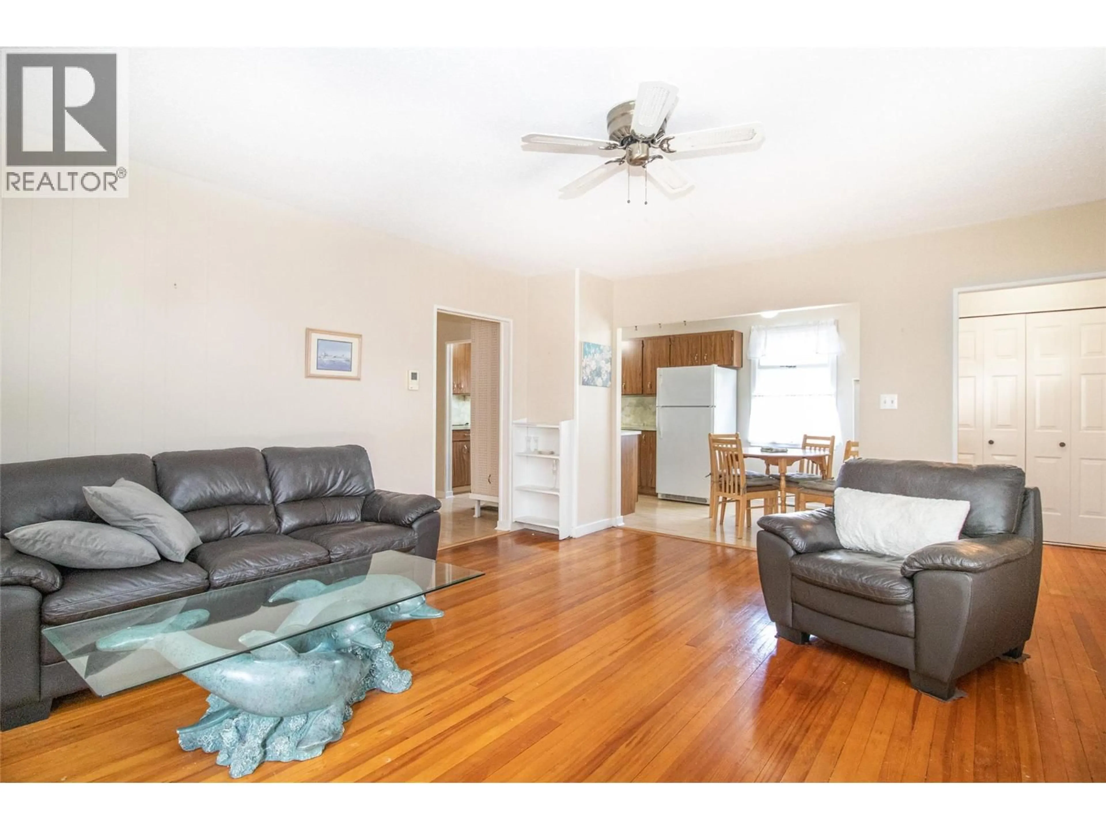 Living room with furniture, wood/laminate floor for 1408 GRAHAM STREET, Kelowna British Columbia V1Y3A8