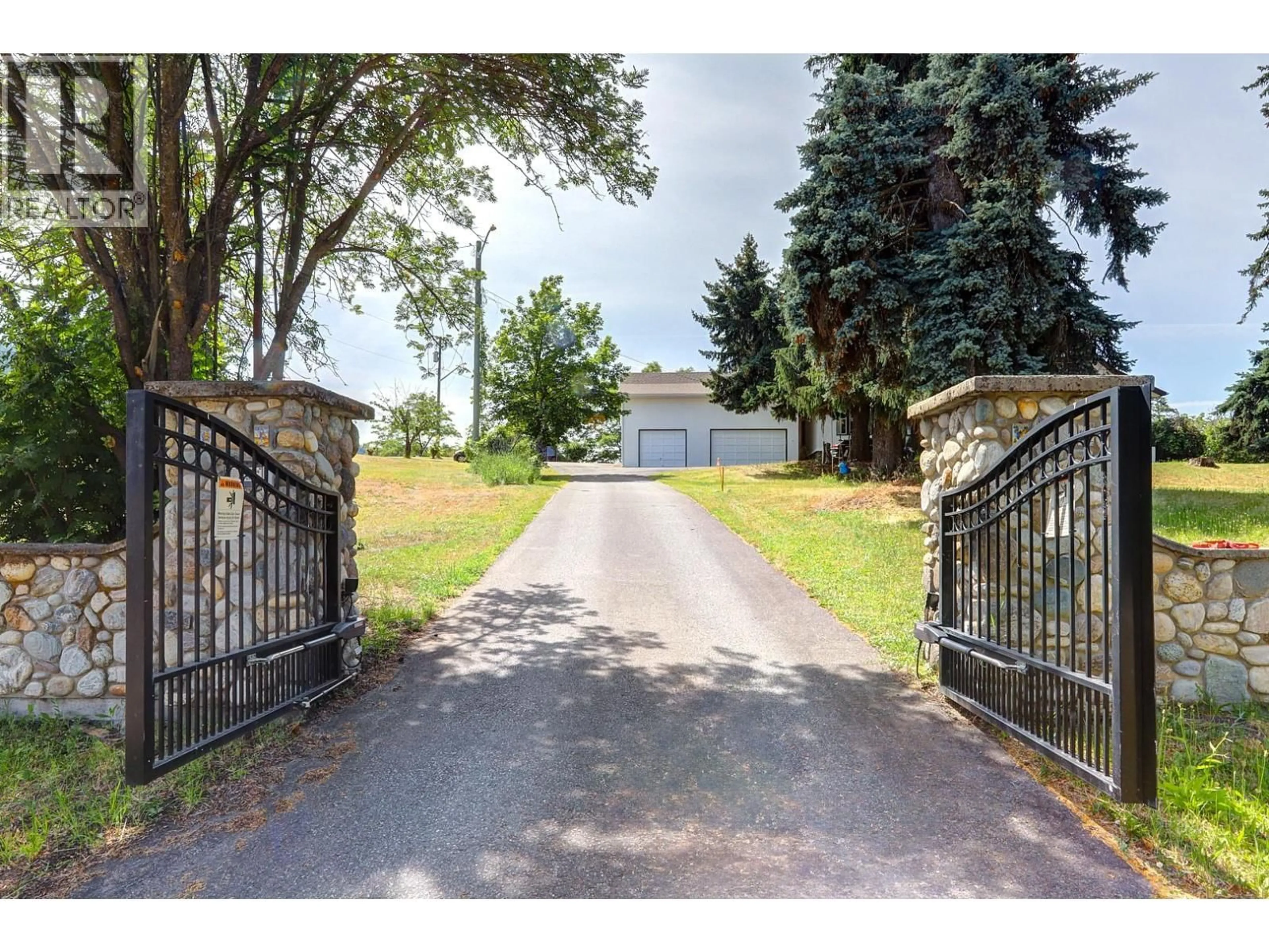 A pic from outside/outdoor area/front of a property/back of a property/a pic from drone, street for 5482 SILVER STAR ROAD, Vernon British Columbia V1B3K4