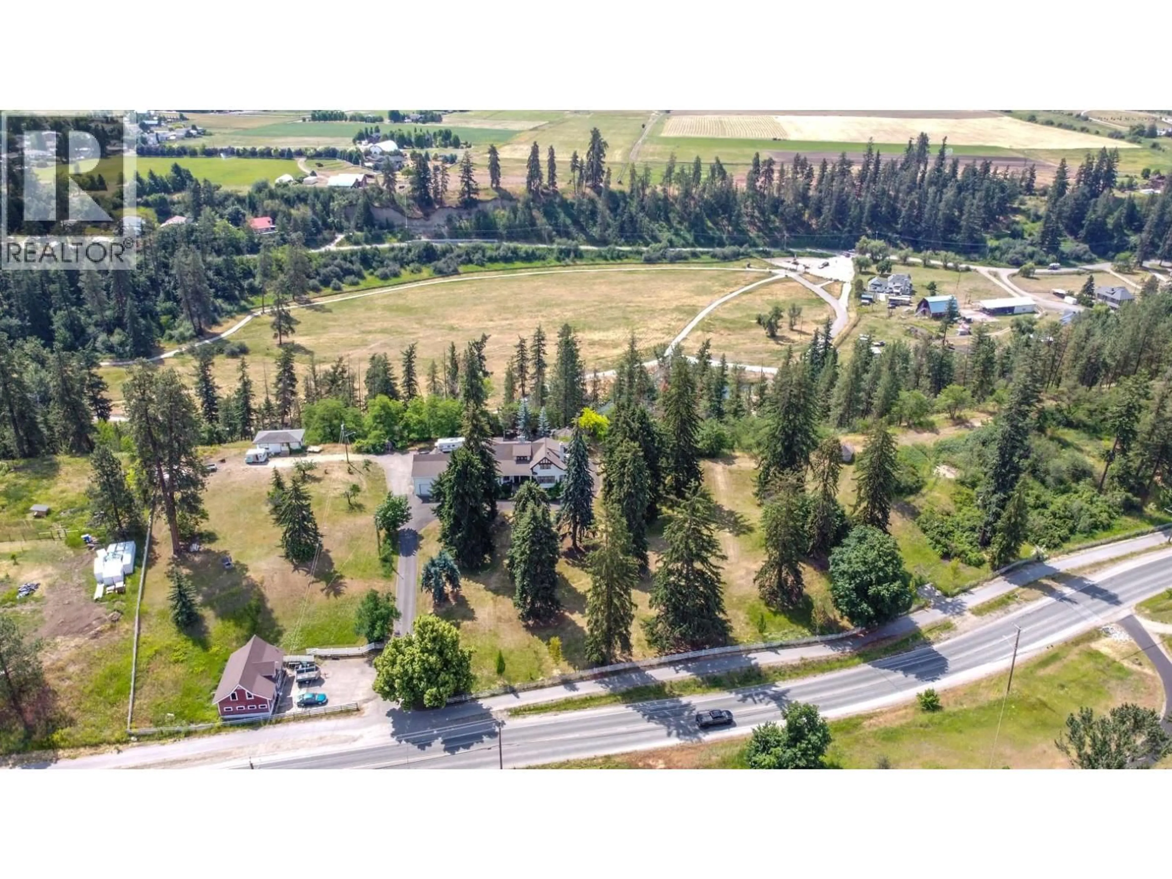 A pic from outside/outdoor area/front of a property/back of a property/a pic from drone, unknown for 5482 SILVER STAR ROAD, Vernon British Columbia V1B3K4