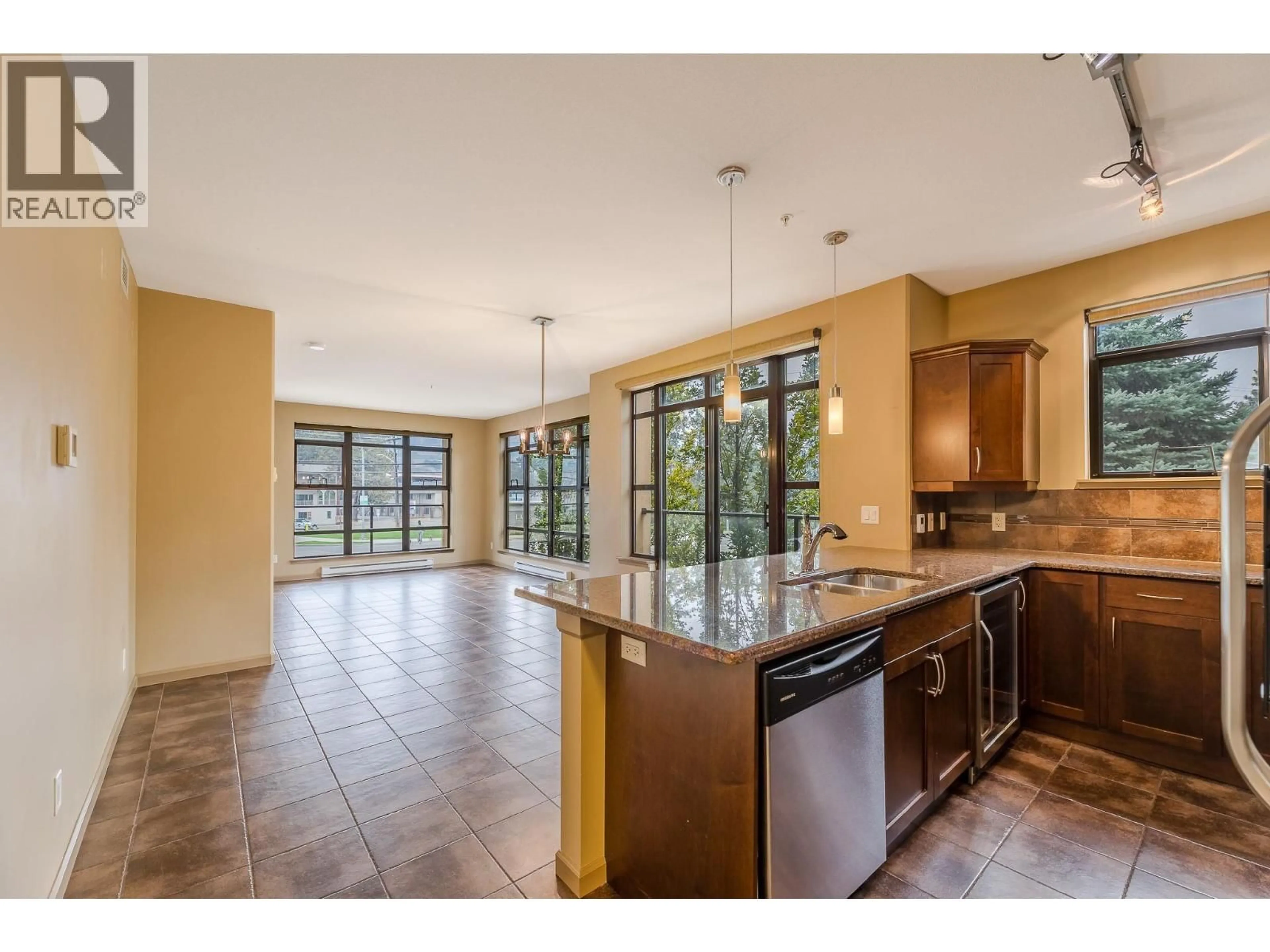 Open concept kitchen, ceramic/tile floor for 204 - 3589 SKAHA LAKE ROAD, Penticton British Columbia V2A7K2