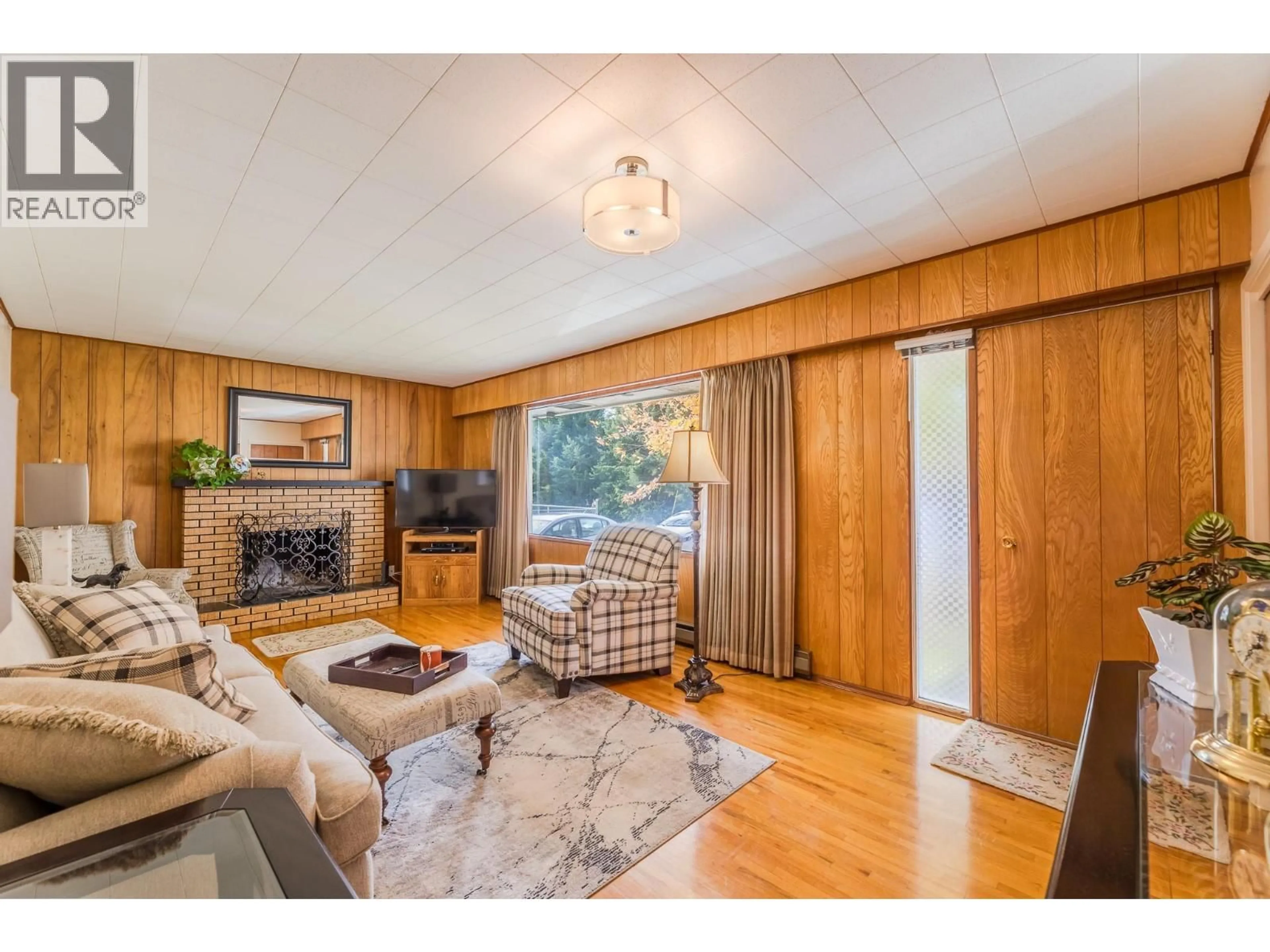 Living room with furniture, wood/laminate floor for 14001 AMM AVENUE, Summerland British Columbia V0H1Z0