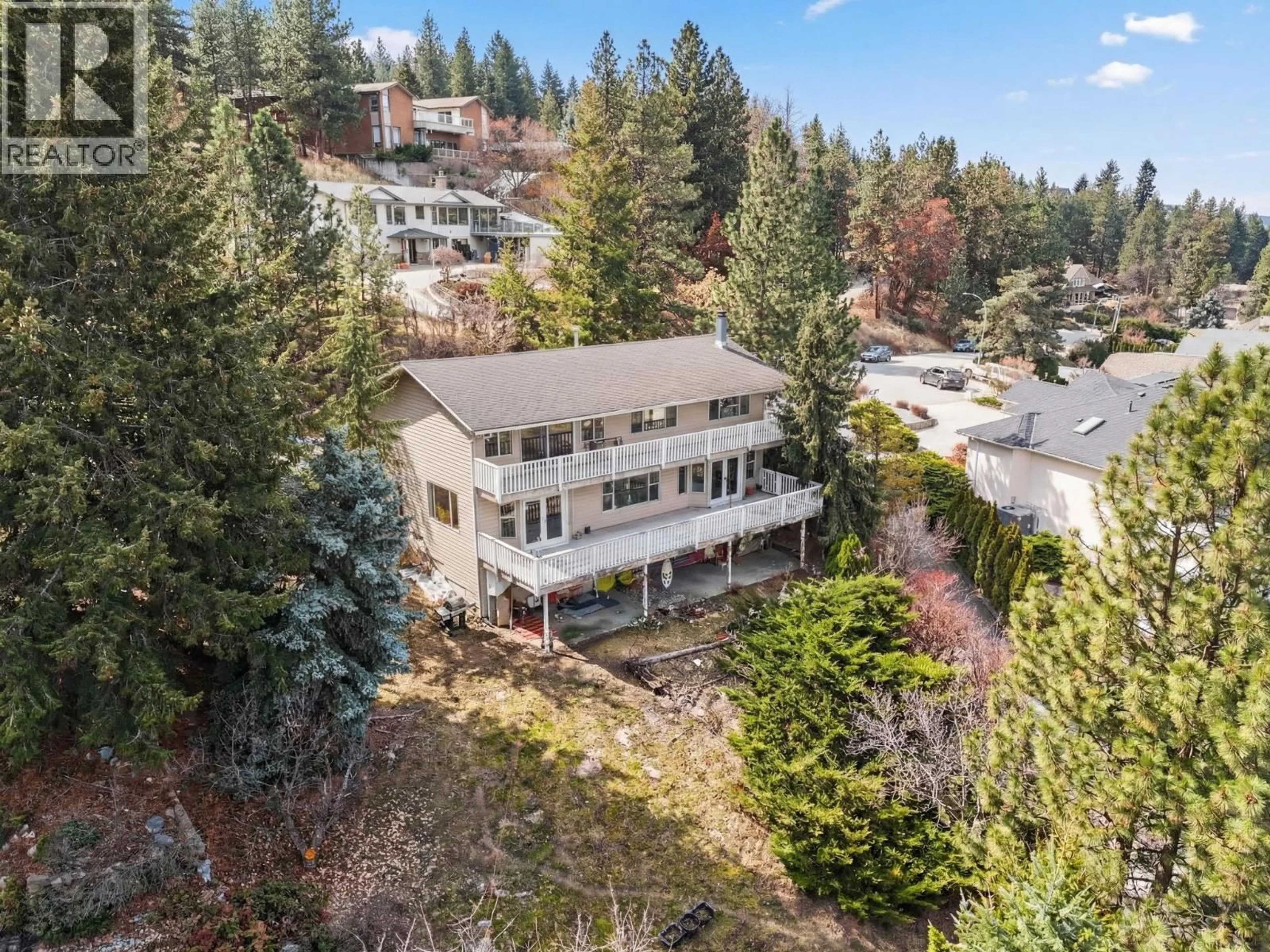 A pic from outside/outdoor area/front of a property/back of a property/a pic from drone, mountain view for 1050 BARTHOLOMEW COURT, Kelowna British Columbia V1W4N2