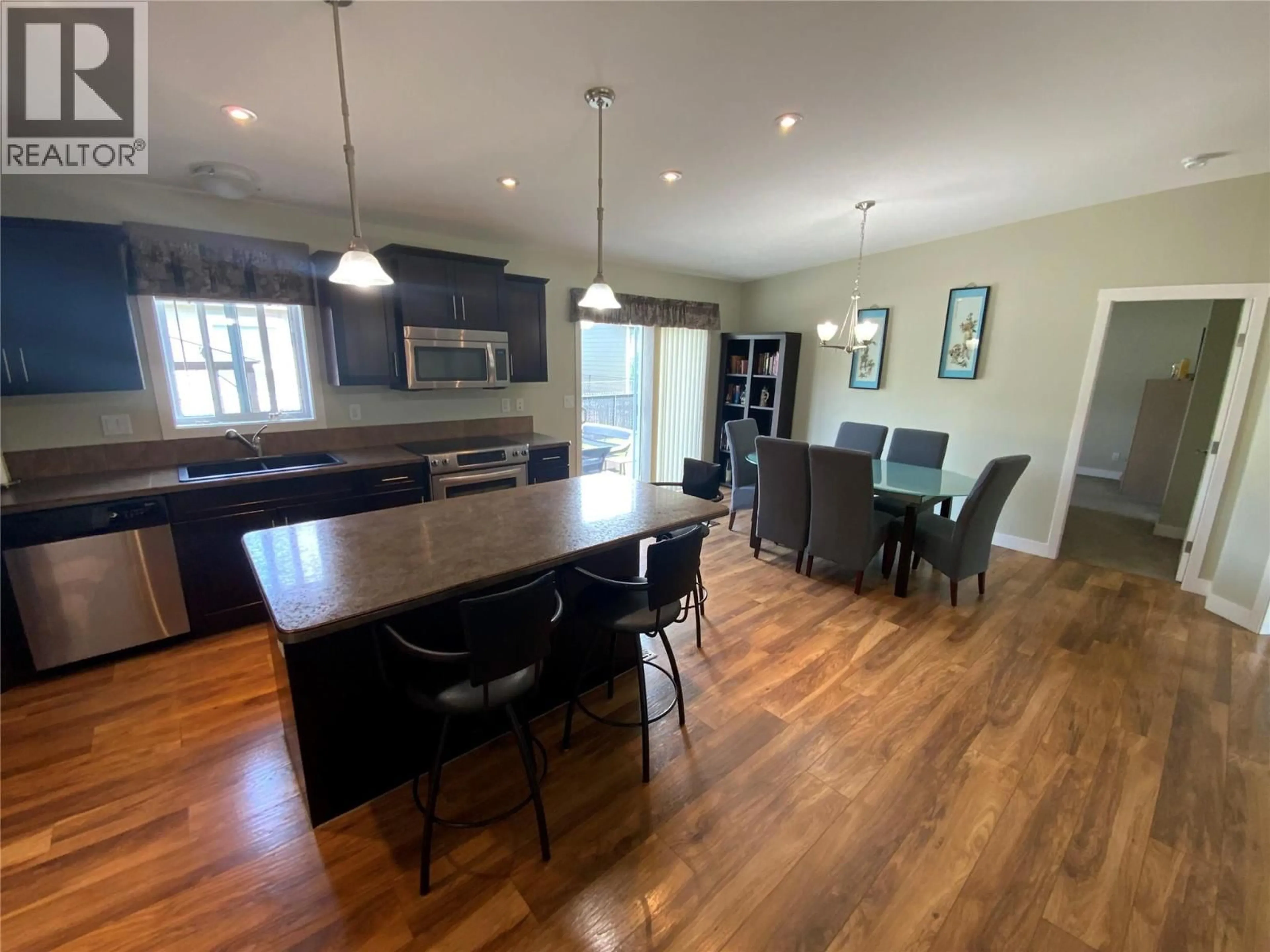 Open concept kitchen, wood/laminate floor for 69 - 8300 GALLAGHER LAKE FRONTAGE ROAD, Oliver British Columbia V0H1T2