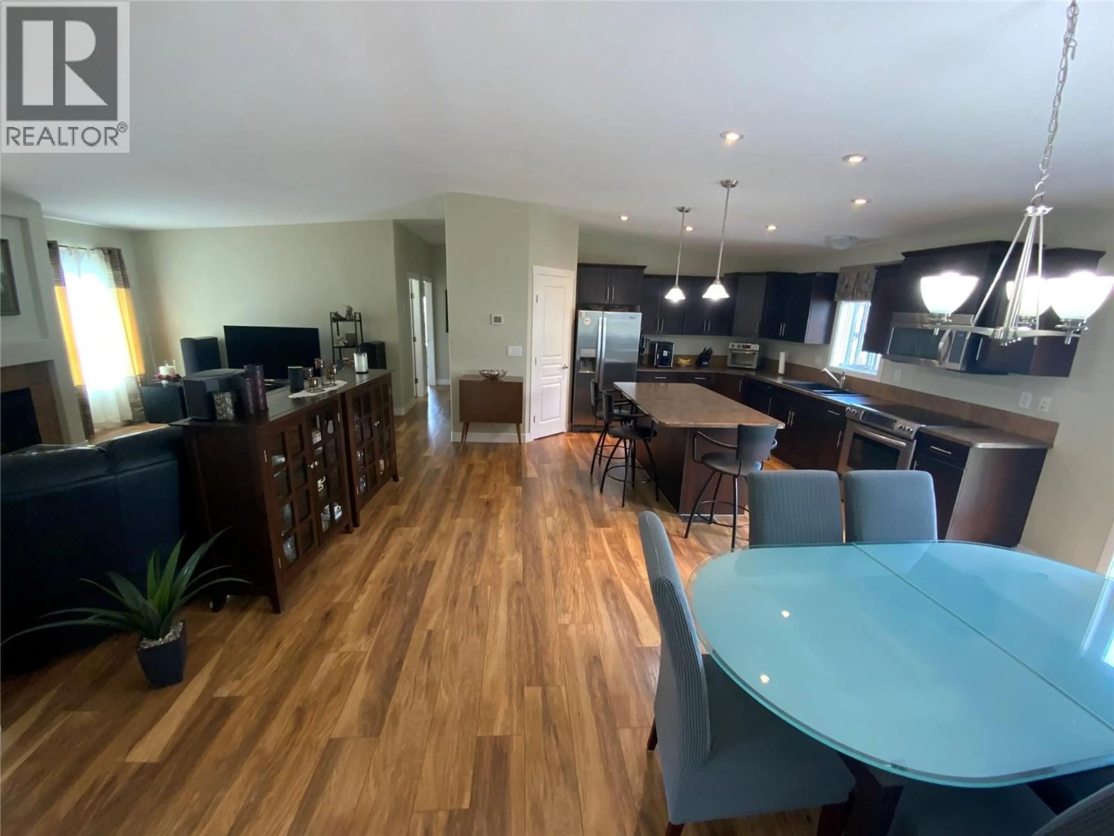 Open concept kitchen, wood/laminate floor for 69 - 8300 GALLAGHER LAKE FRONTAGE ROAD, Oliver British Columbia V0H1T2