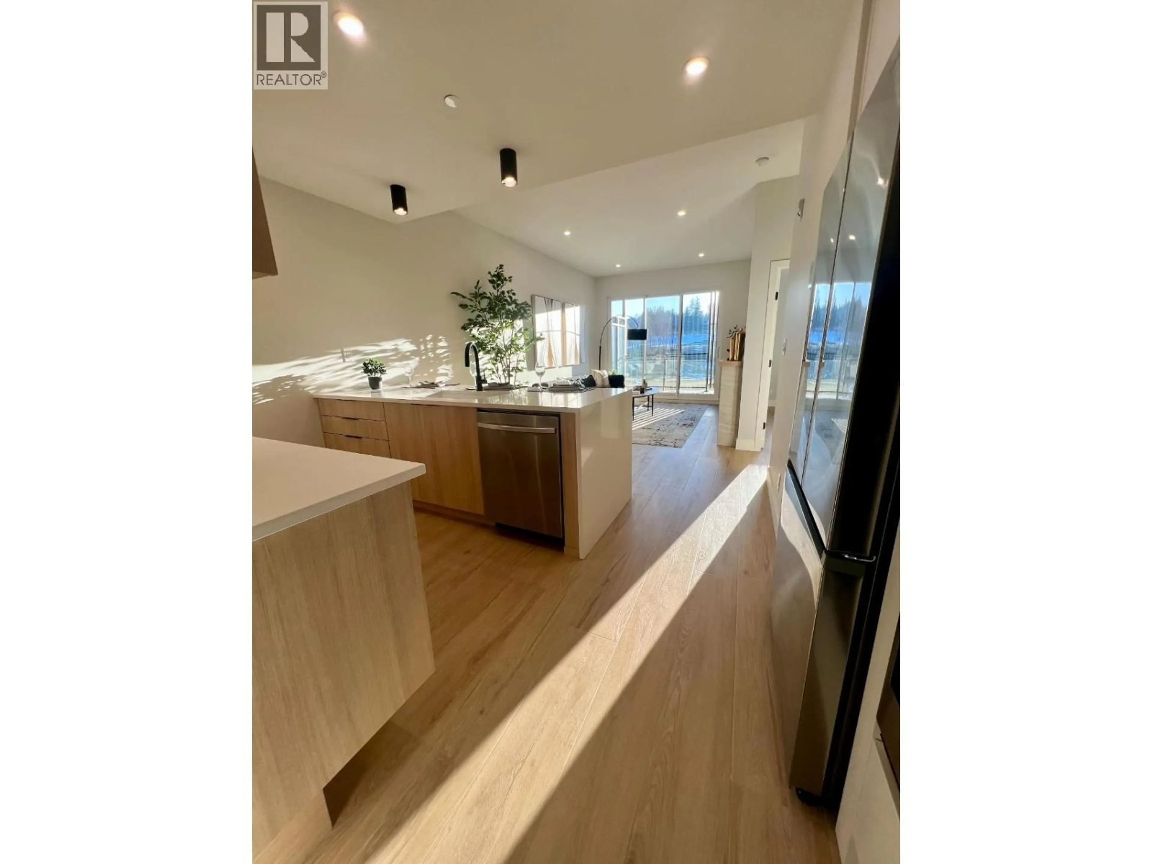 Open concept kitchen, unknown for 406 - 75 PREDATOR RIDGE DRIVE, Vernon British Columbia V1H2H6