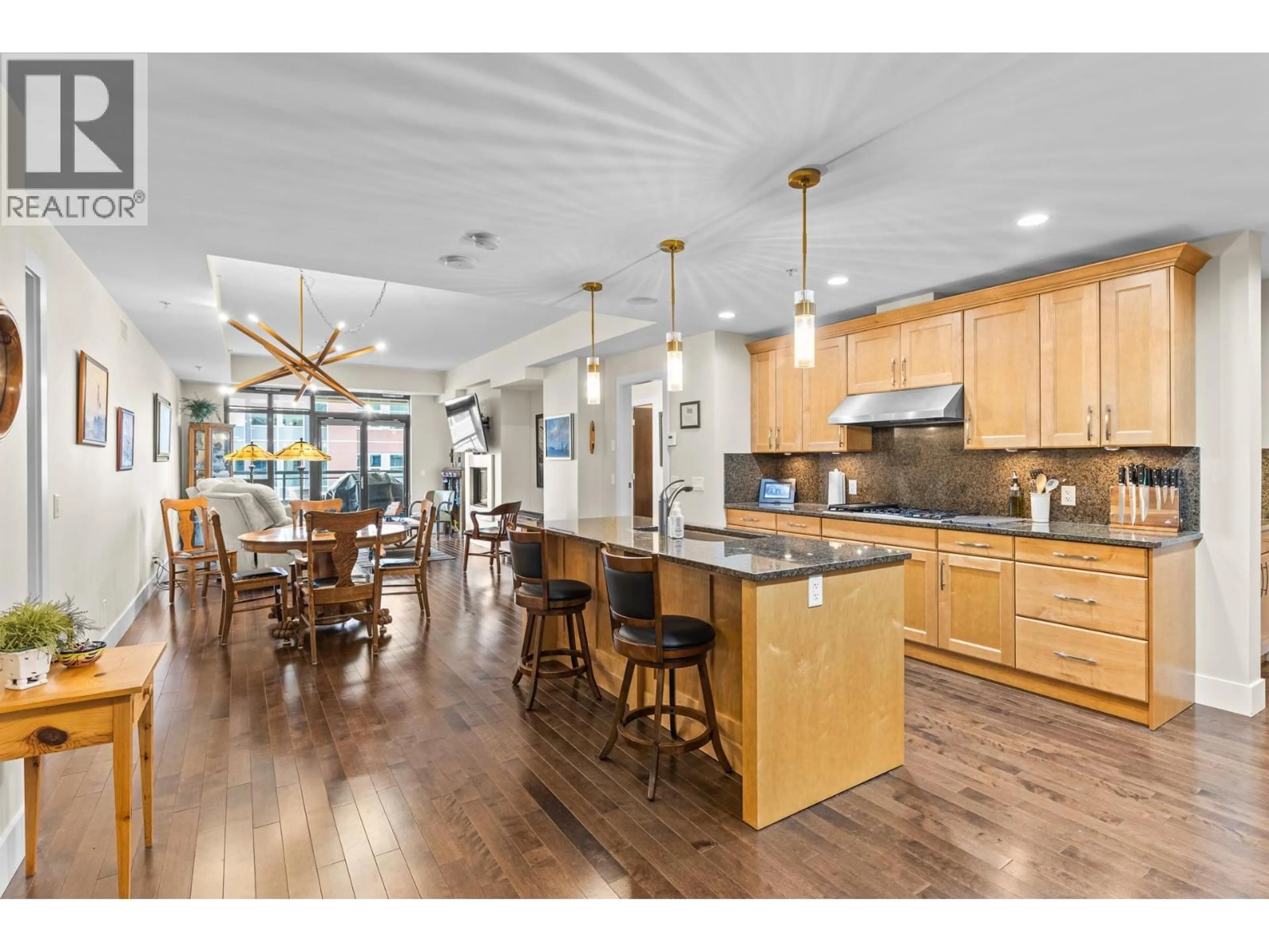Open concept kitchen, wood/laminate floor for 506 - 1395 ELLIS STREET, Kelowna British Columbia V1Y1Z9