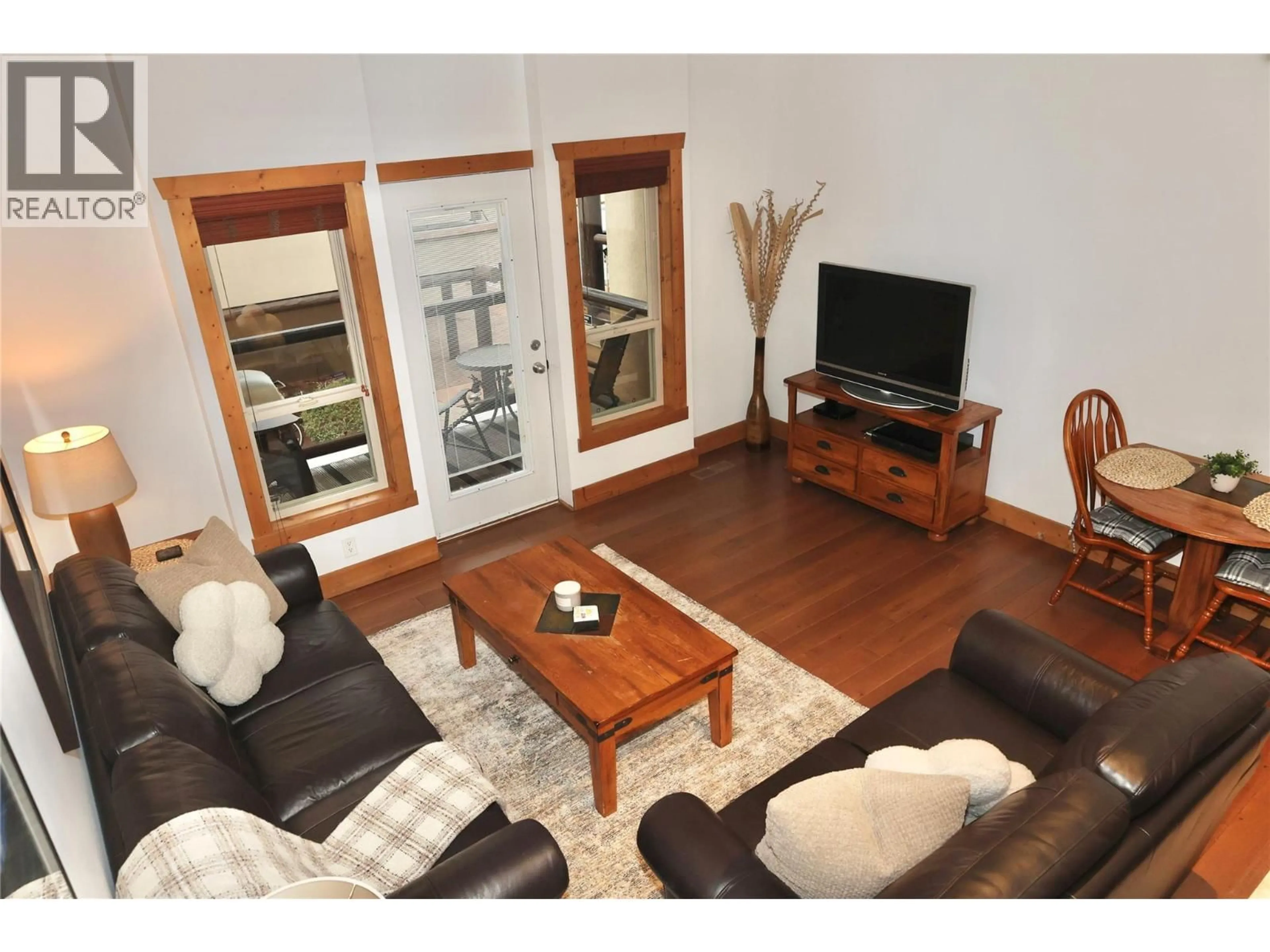 Living room with furniture, wood/laminate floor for 205 - 5401 LAKESHORE DRIVE, Osoyoos British Columbia V0H1V6