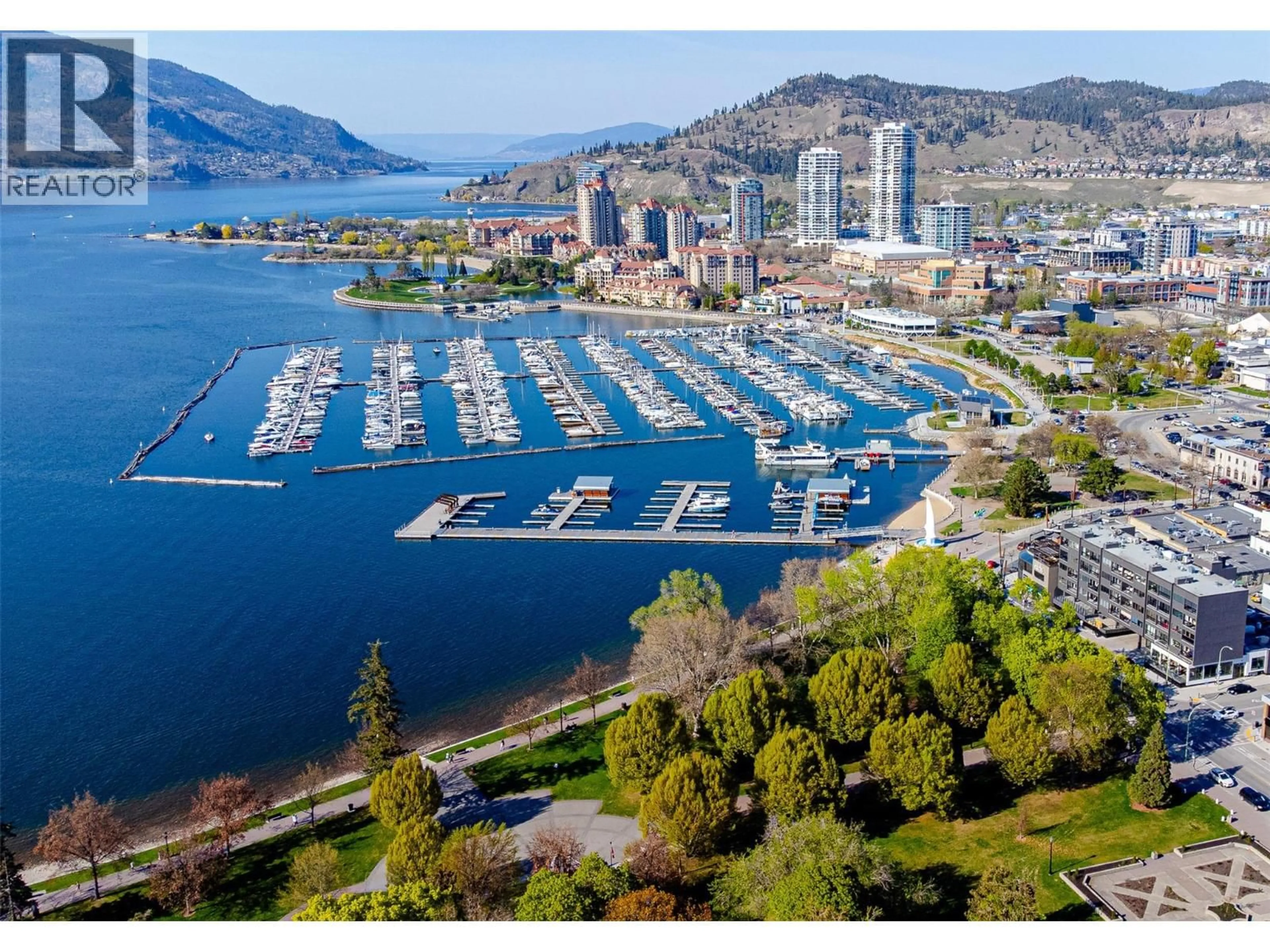 A pic from outside/outdoor area/front of a property/back of a property/a pic from drone, water/lake/river/ocean view for 1404 - 1191 SUNSET DRIVE, Kelowna British Columbia V1Y0J4