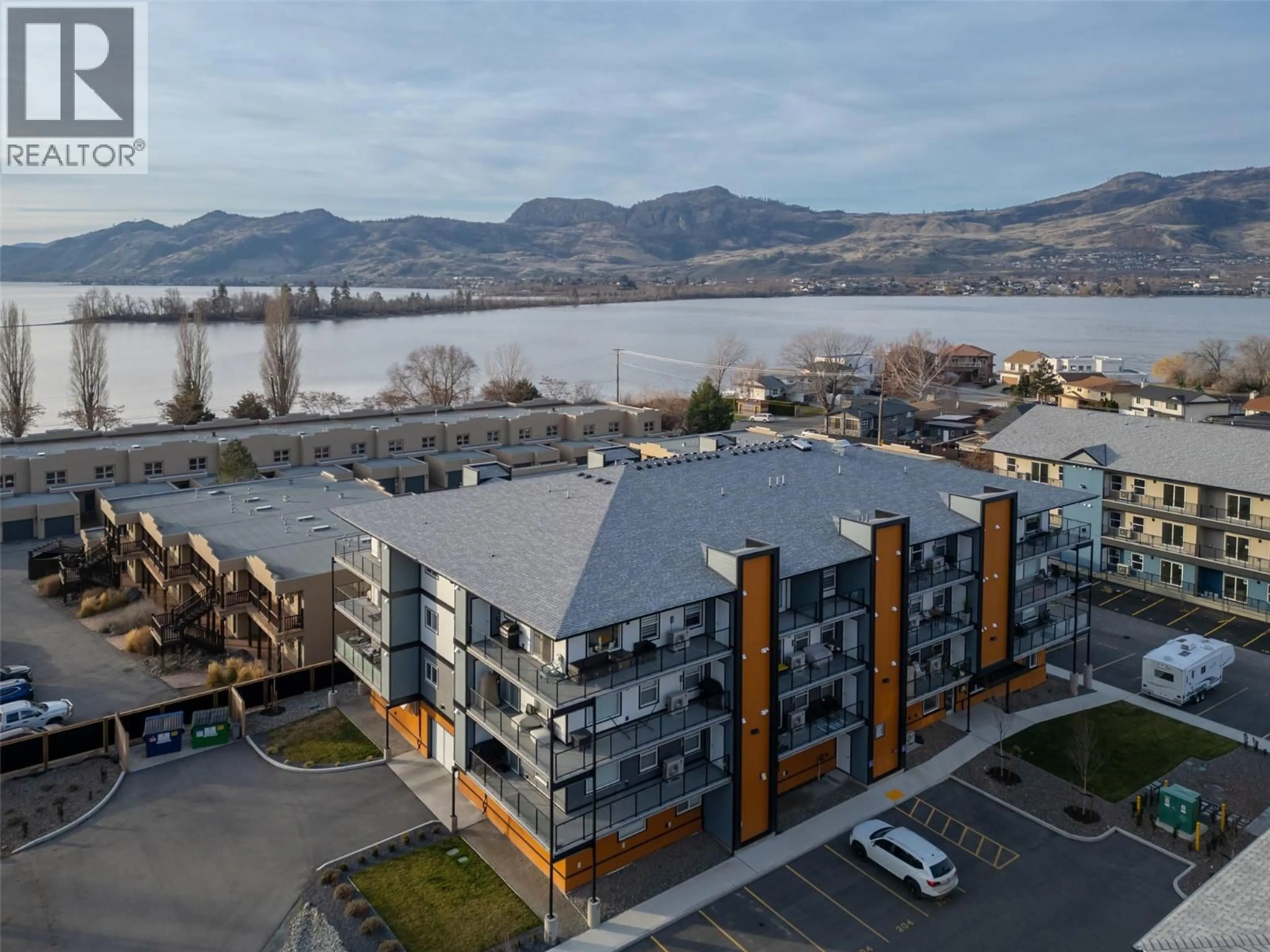 A pic from outside/outdoor area/front of a property/back of a property/a pic from drone, water/lake/river/ocean view for 301 - 5620 51 STREET, Osoyoos British Columbia V0H1V6