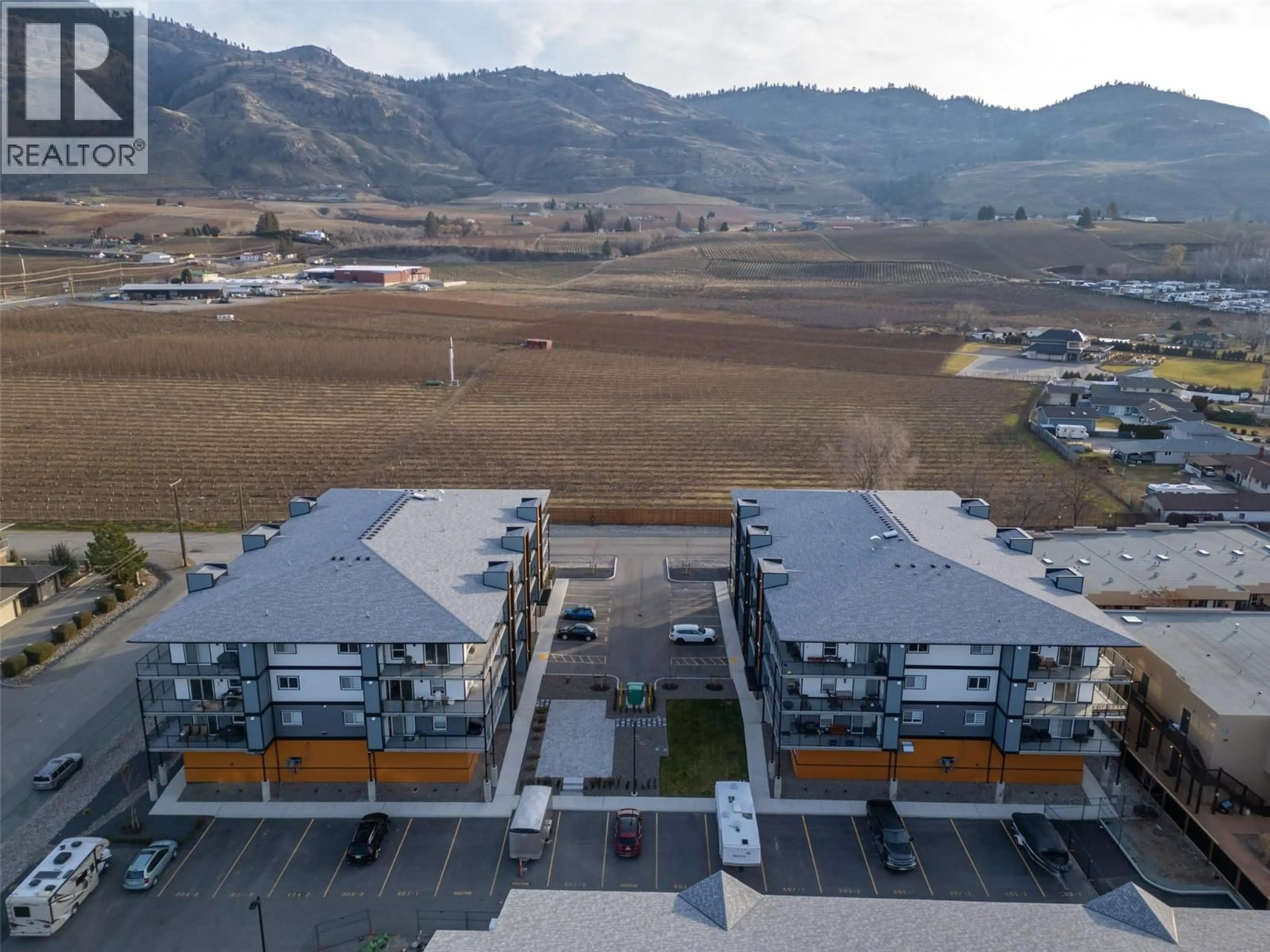 A pic from outside/outdoor area/front of a property/back of a property/a pic from drone, mountain view for 301 - 5620 51 STREET, Osoyoos British Columbia V0H1V6