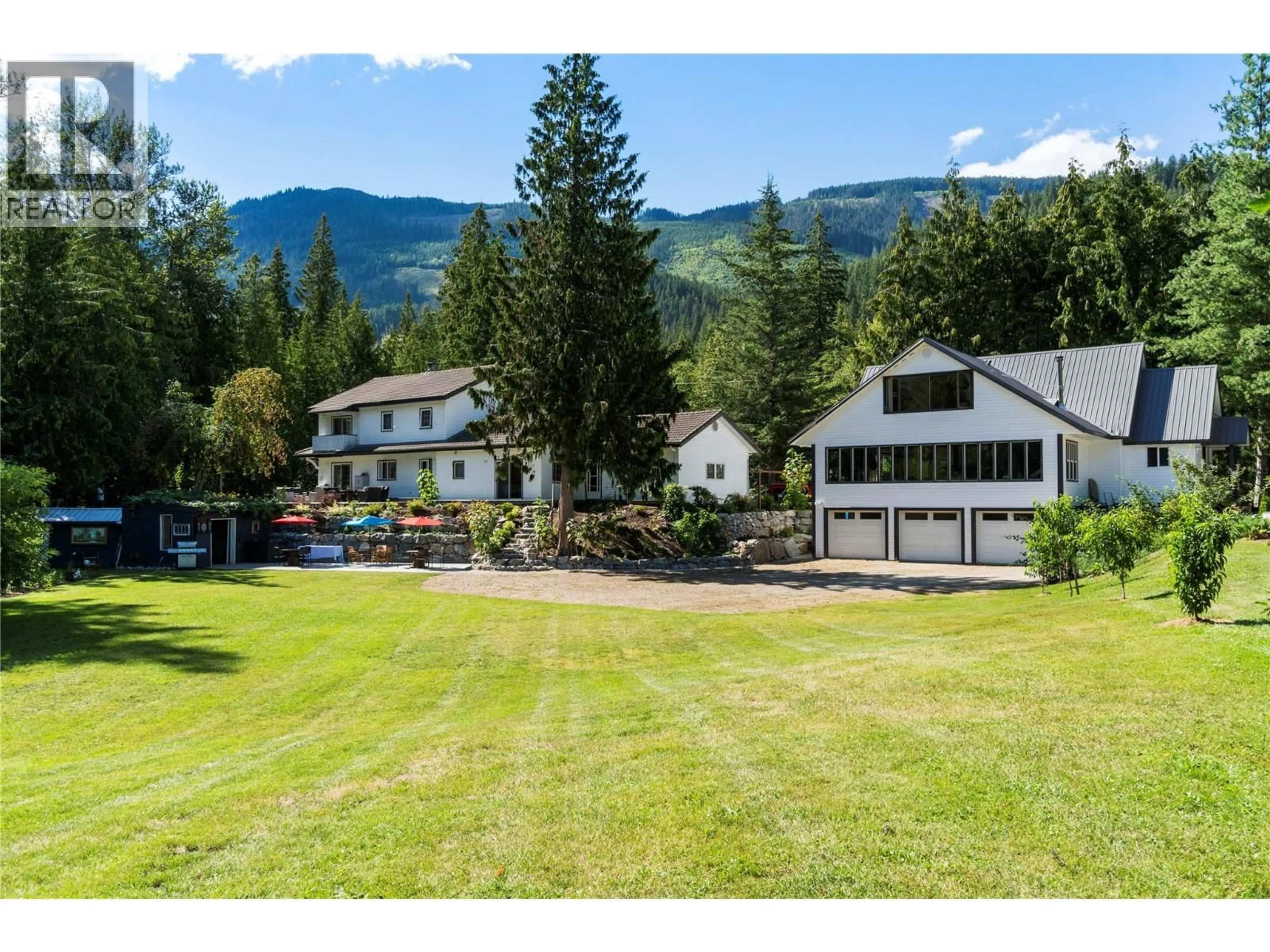 A pic from outside/outdoor area/front of a property/back of a property/a pic from drone, mountain view for 2012 BUNDUS ROAD, Sicamous British Columbia V0E2V4