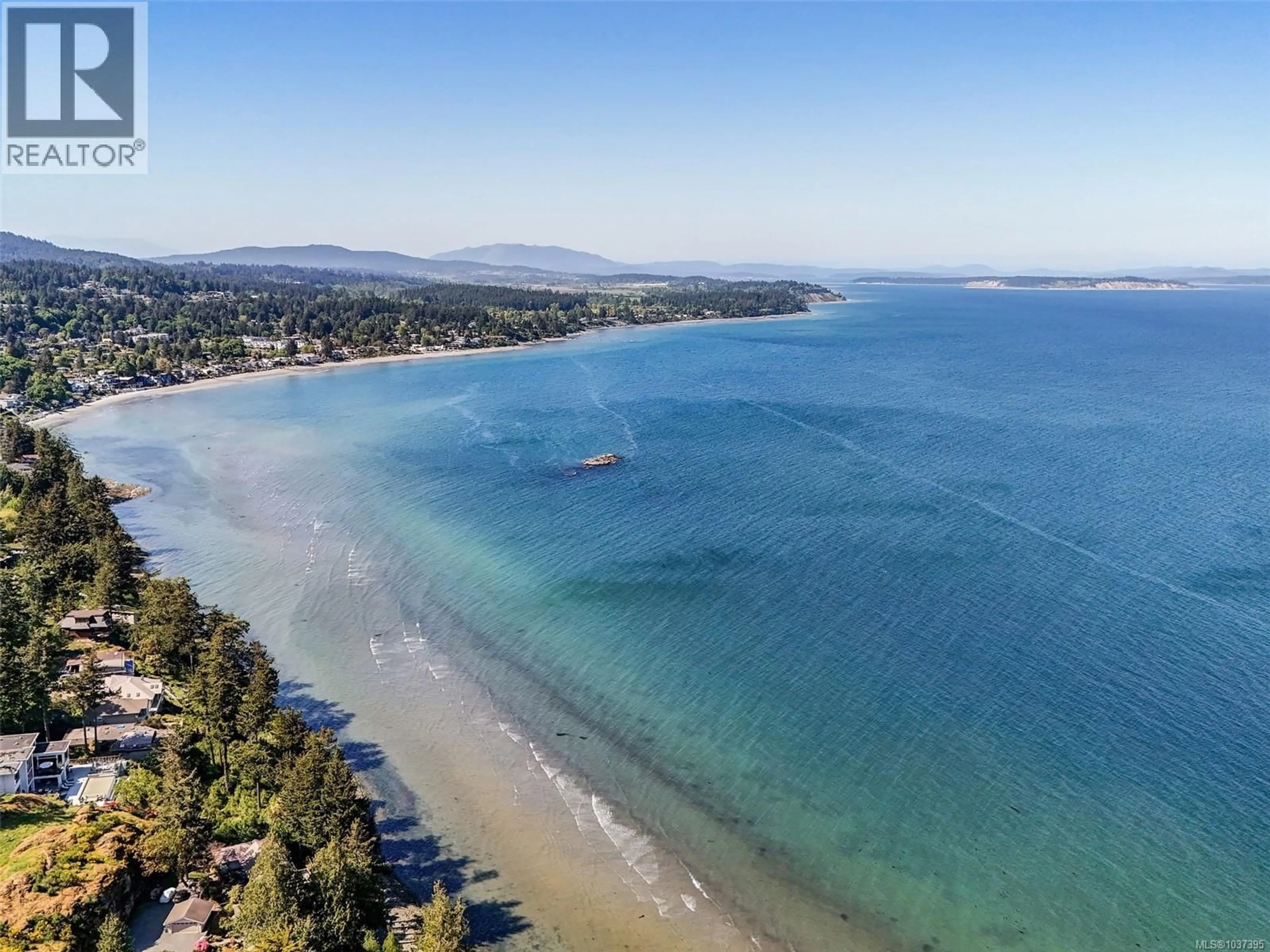 A pic from outside/outdoor area/front of a property/back of a property/a pic from drone, water/lake/river/ocean view for 1 - 4771 CORDOVA BAY ROAD, Saanich British Columbia V8Y2J7