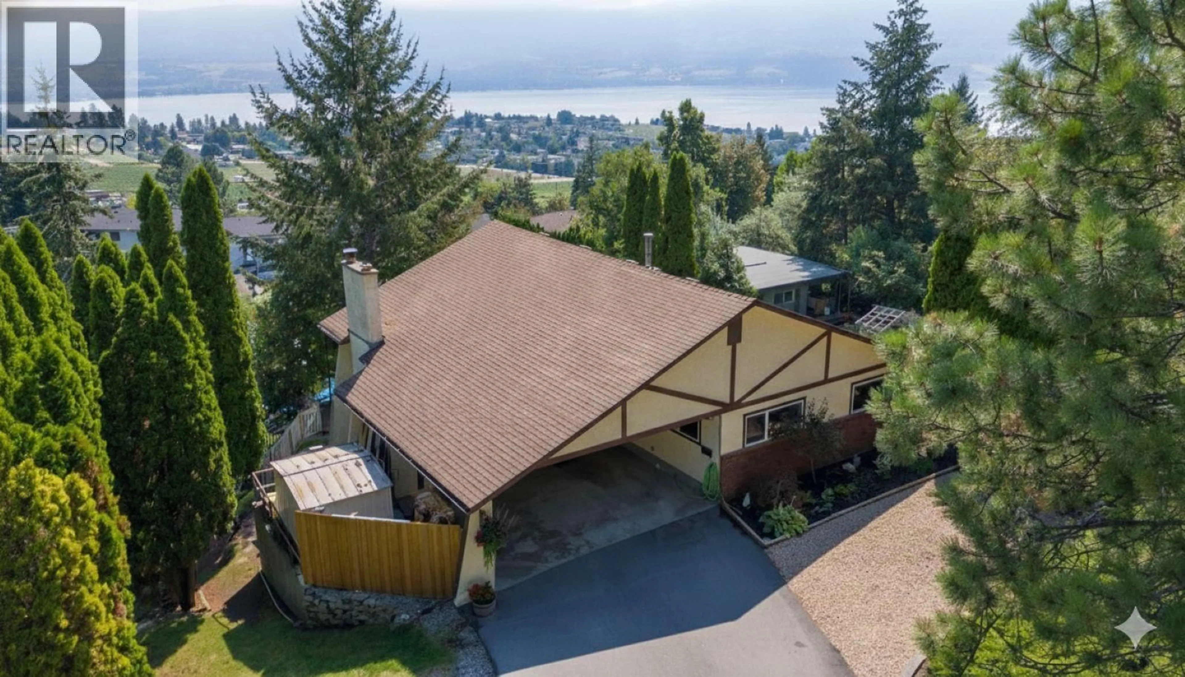 A pic from outside/outdoor area/front of a property/back of a property/a pic from drone, mountain view for 1175 TREVOR DRIVE, West Kelowna British Columbia V1Z2K1