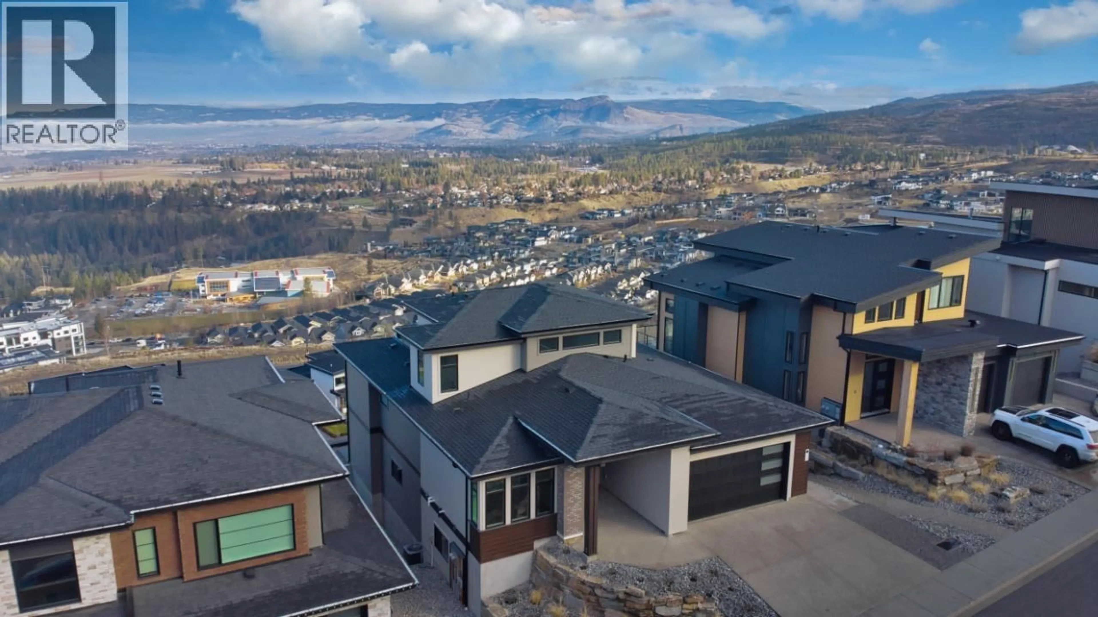 A pic from outside/outdoor area/front of a property/back of a property/a pic from drone, mountain view for 1030 EMSLIE STREET, Kelowna British Columbia V1W0C3