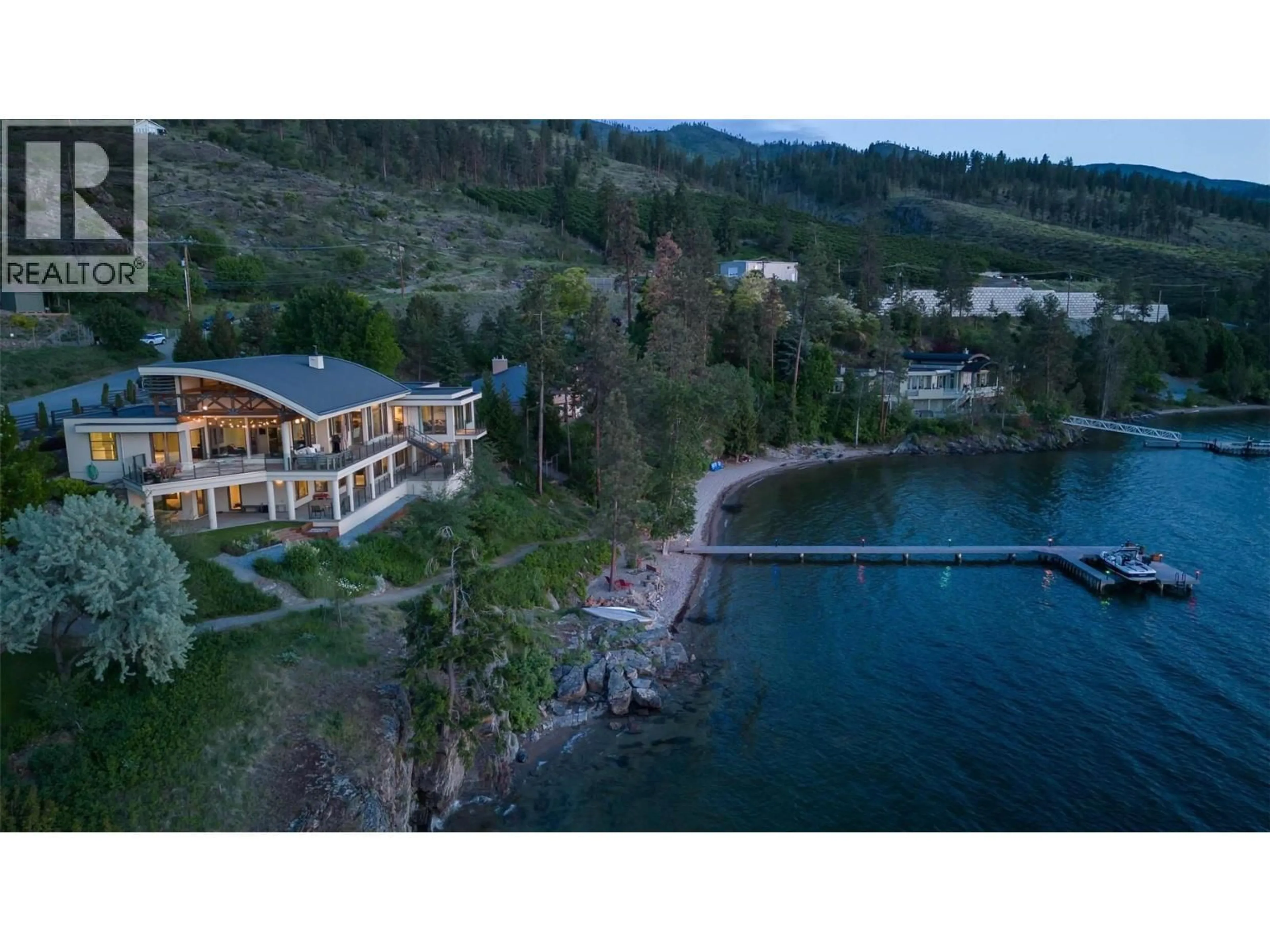 A pic from outside/outdoor area/front of a property/back of a property/a pic from drone, water/lake/river/ocean view for 5560 LAKESHORE ROAD, Kelowna British Columbia V1W4J4
