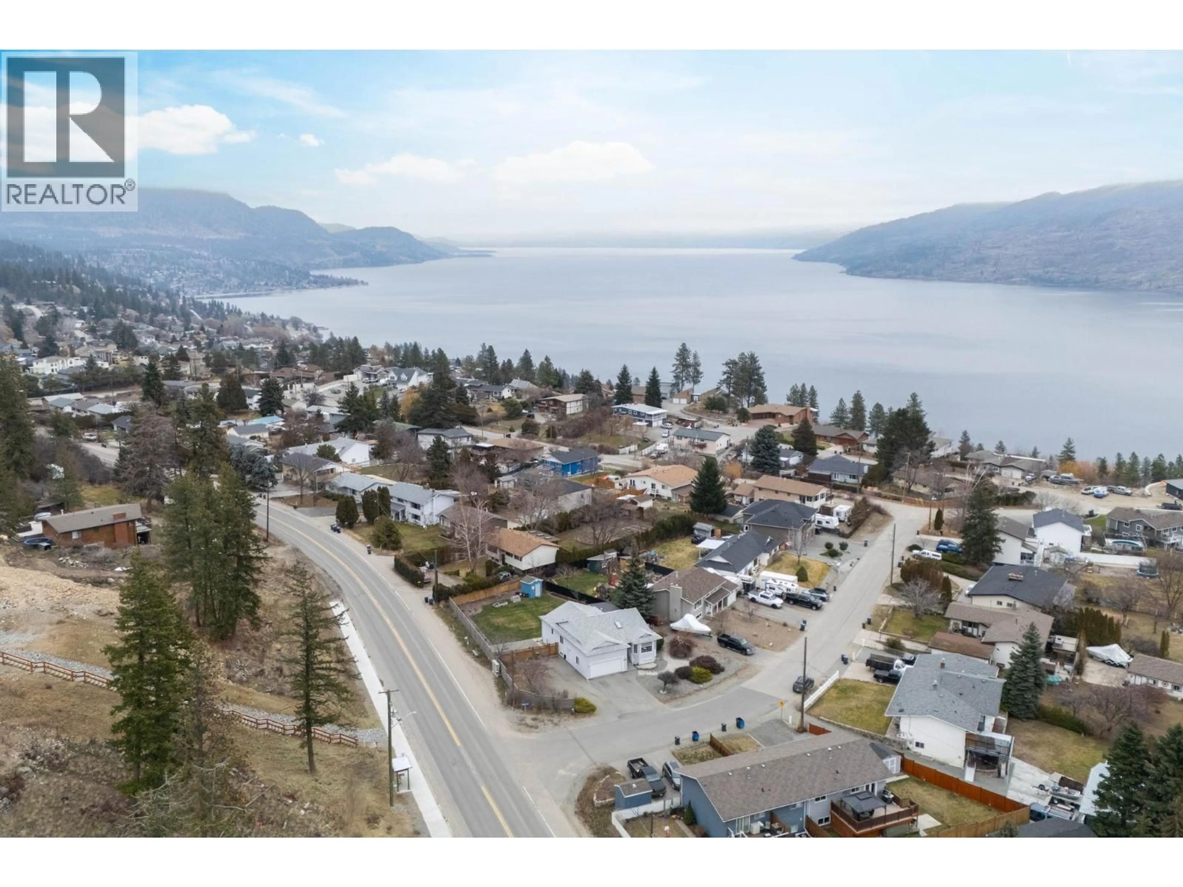 A pic from outside/outdoor area/front of a property/back of a property/a pic from drone, water/lake/river/ocean view for 6292 WHINTON CRESCENT, Peachland British Columbia V0H1X7