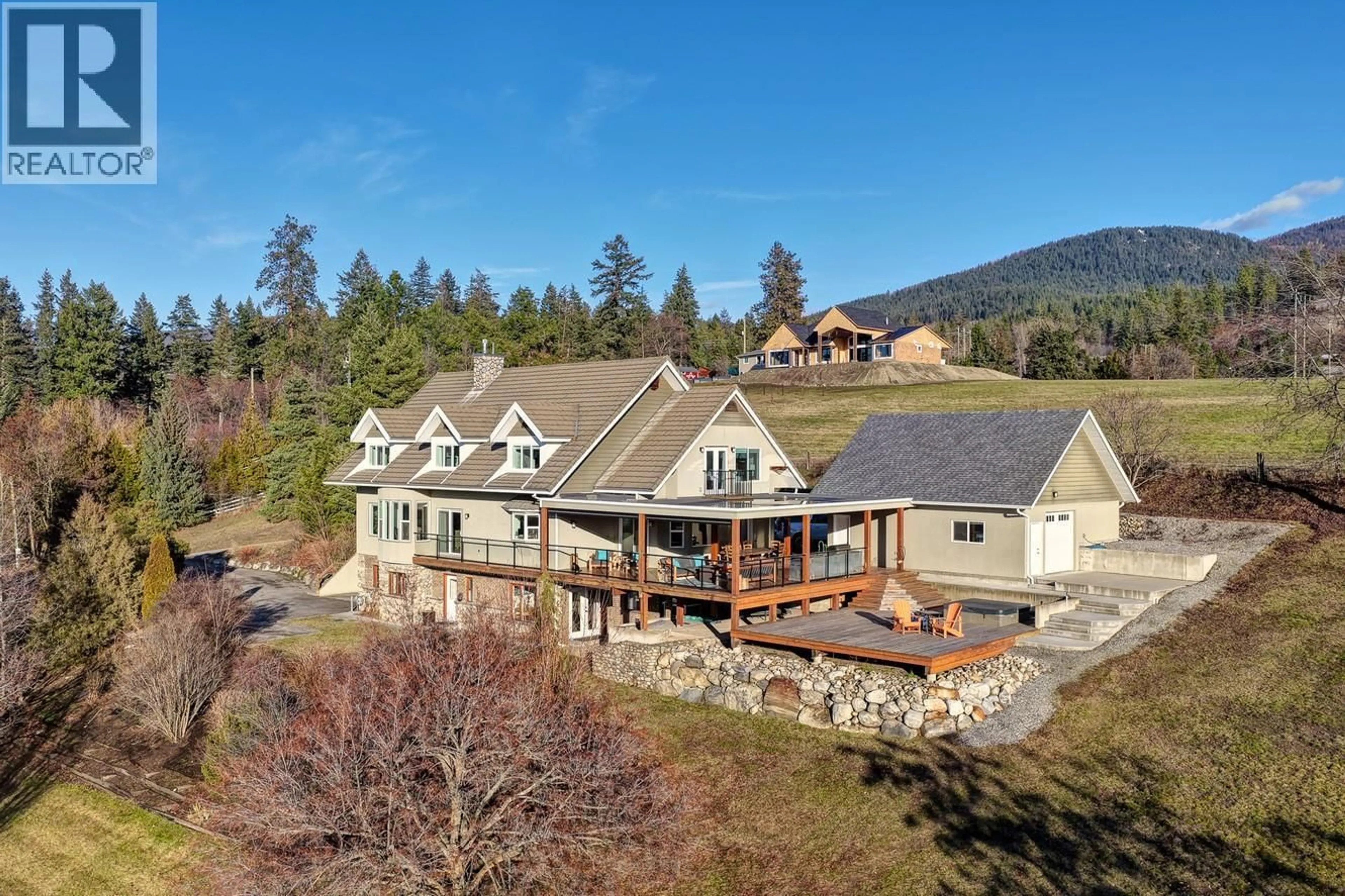 A pic from outside/outdoor area/front of a property/back of a property/a pic from drone, mountain view for 5393 EAST VERNON ROAD, Vernon British Columbia V1B3J7