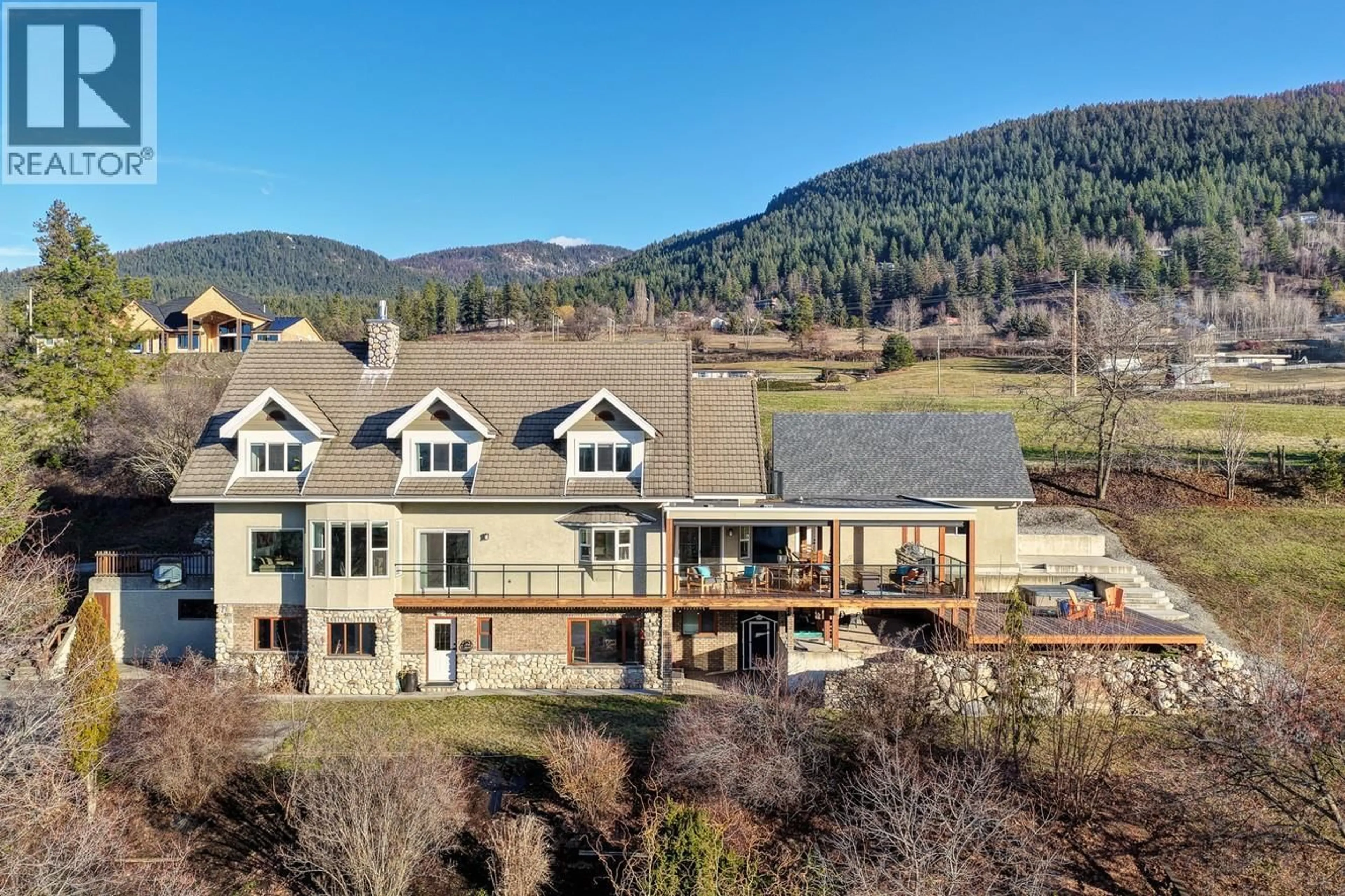 A pic from outside/outdoor area/front of a property/back of a property/a pic from drone, mountain view for 5393 EAST VERNON ROAD, Vernon British Columbia V1B3J7