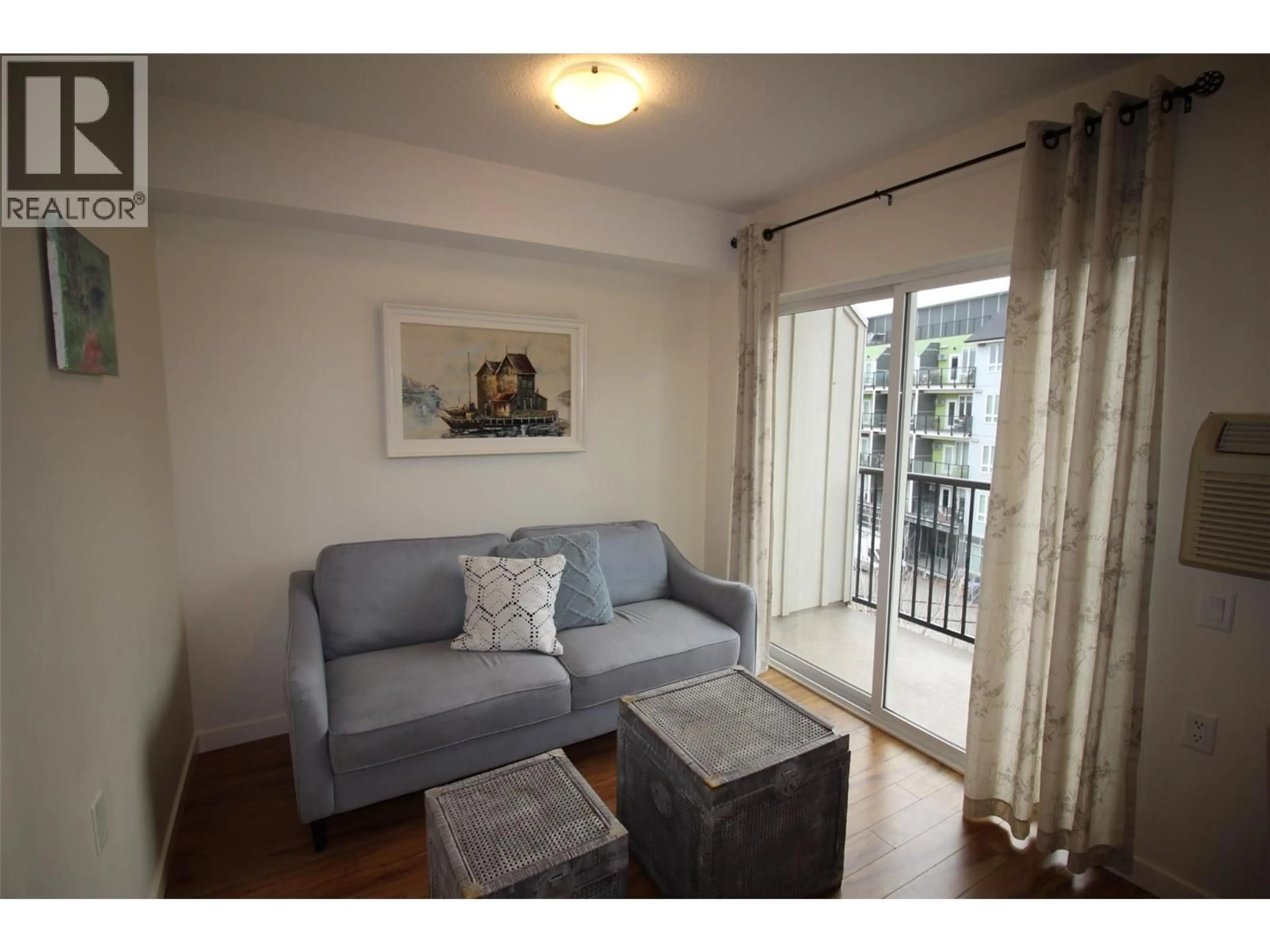 Living room with furniture, wood/laminate floor for 407 - 375 CHERRY AVENUE, Kamloops British Columbia V2B0E1