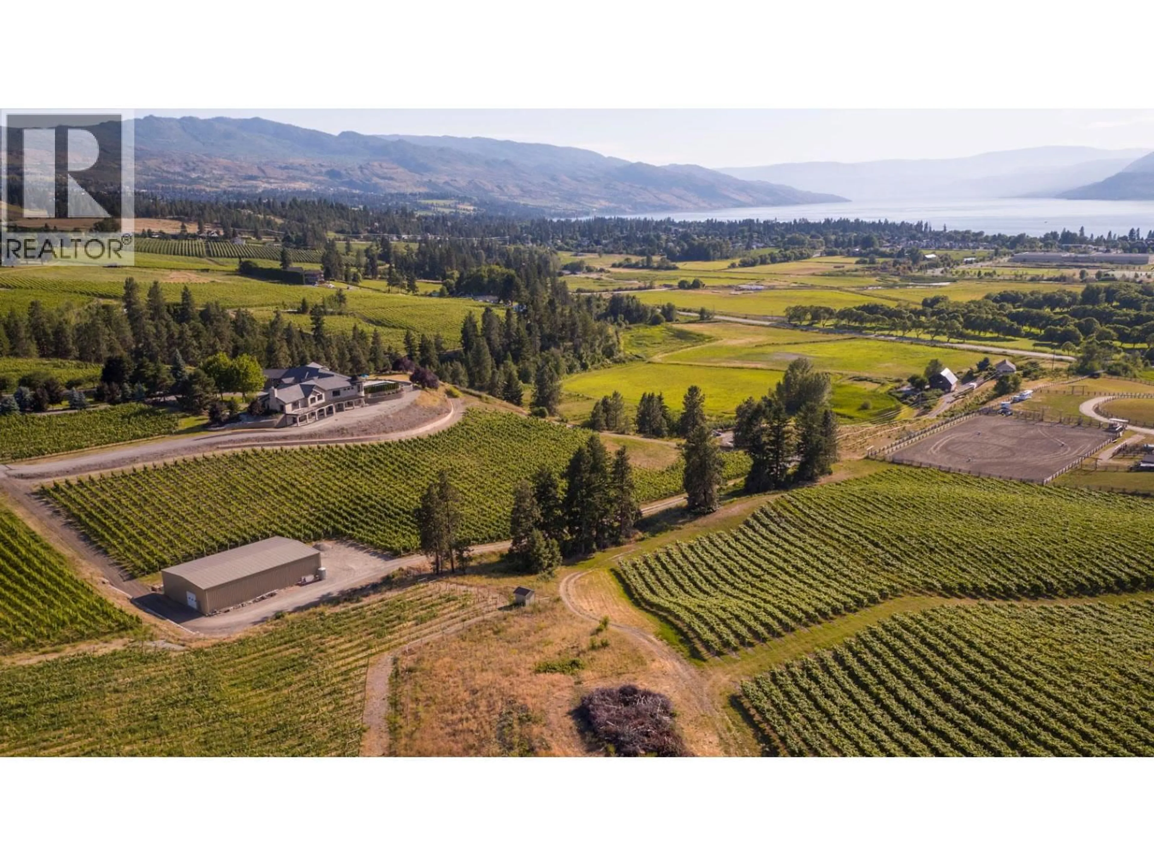 A pic from outside/outdoor area/front of a property/back of a property/a pic from drone, mountain view for 3995 SWAMP ROAD, Kelowna British Columbia V1W4M9