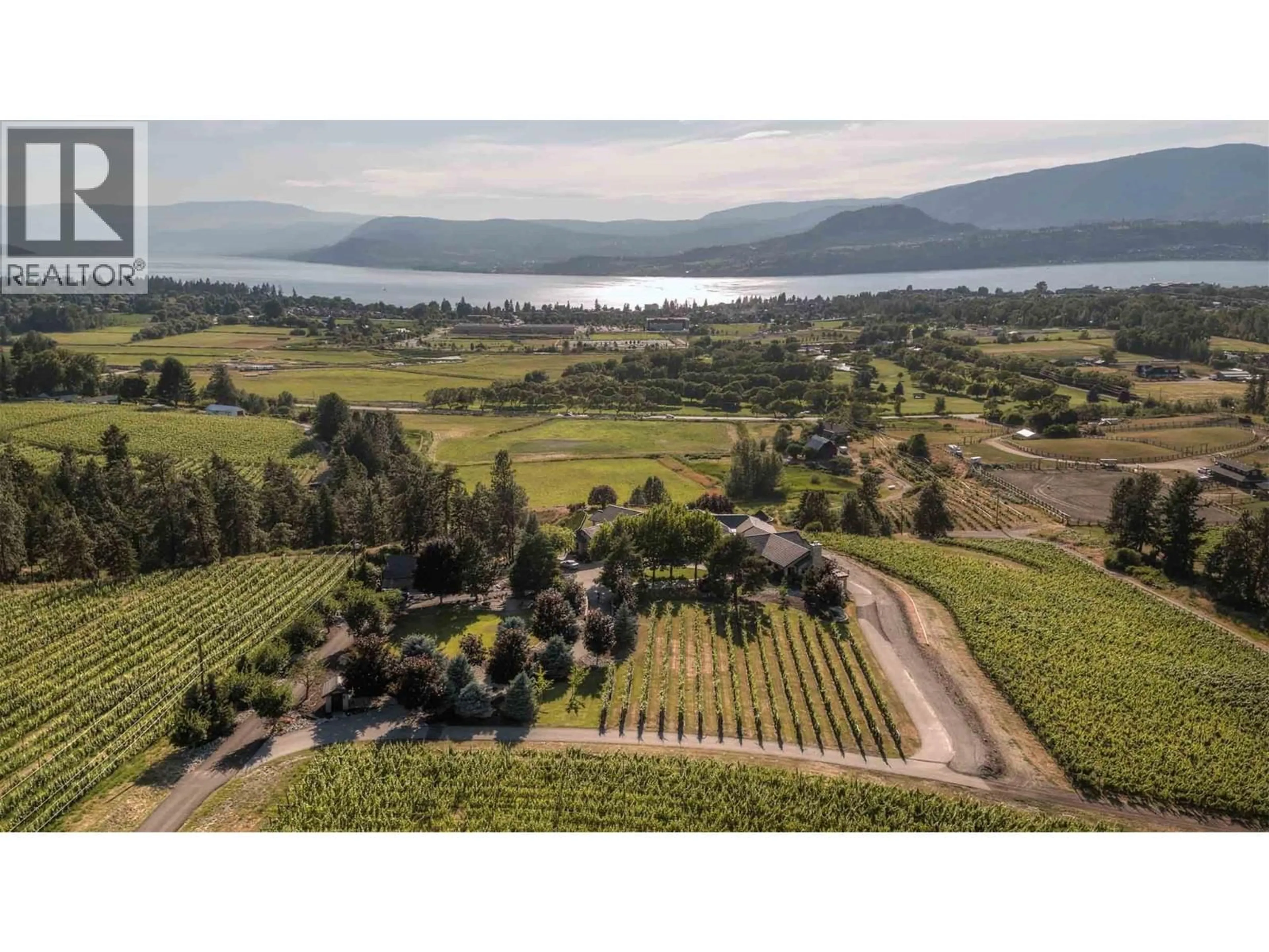 A pic from outside/outdoor area/front of a property/back of a property/a pic from drone, water/lake/river/ocean view for 3995 SWAMP ROAD, Kelowna British Columbia V1W4M9