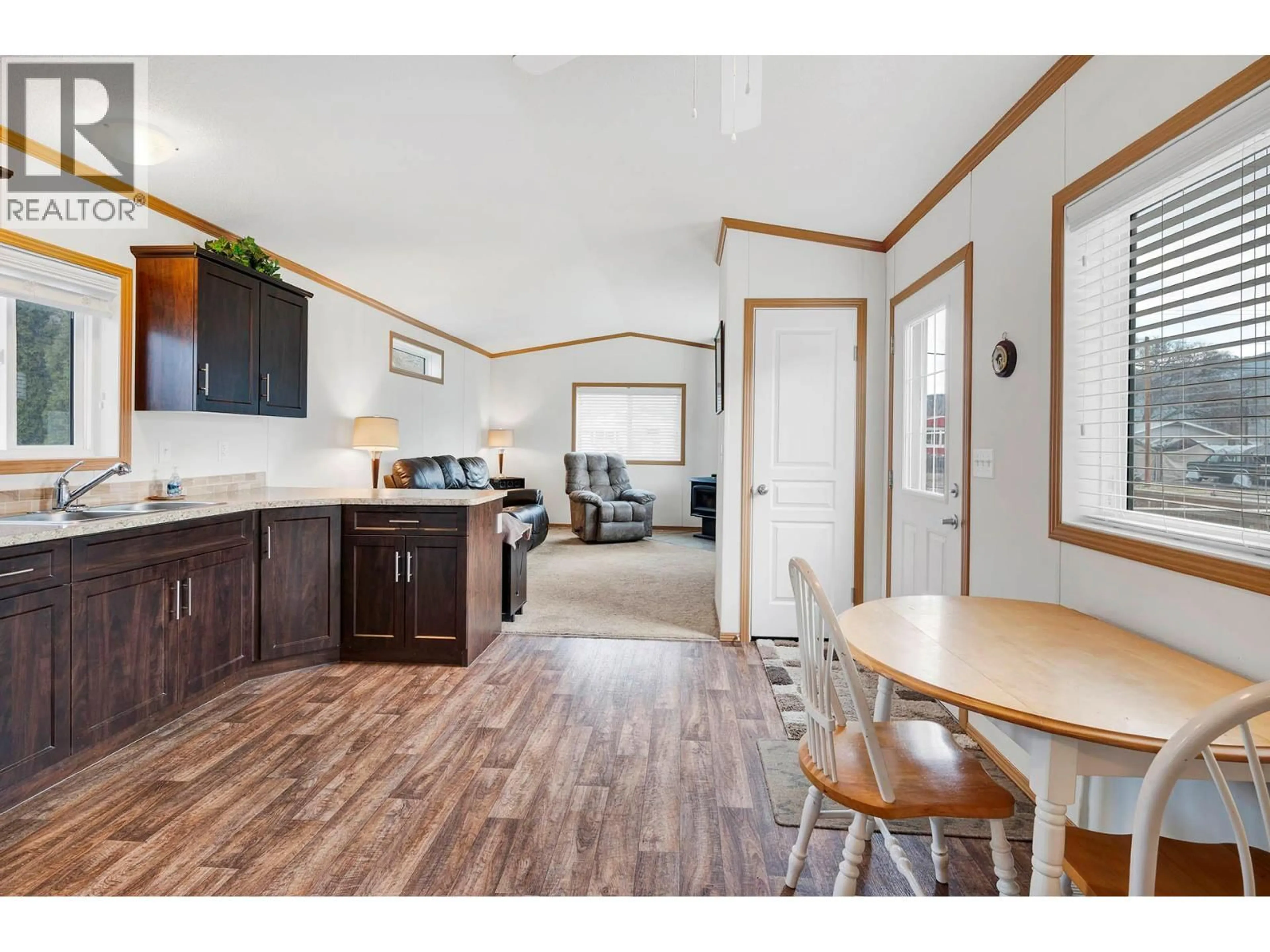 Open concept kitchen, wood/laminate floor for 1317 BOSTOCK CRESCENT, Pritchard British Columbia V0E2P0