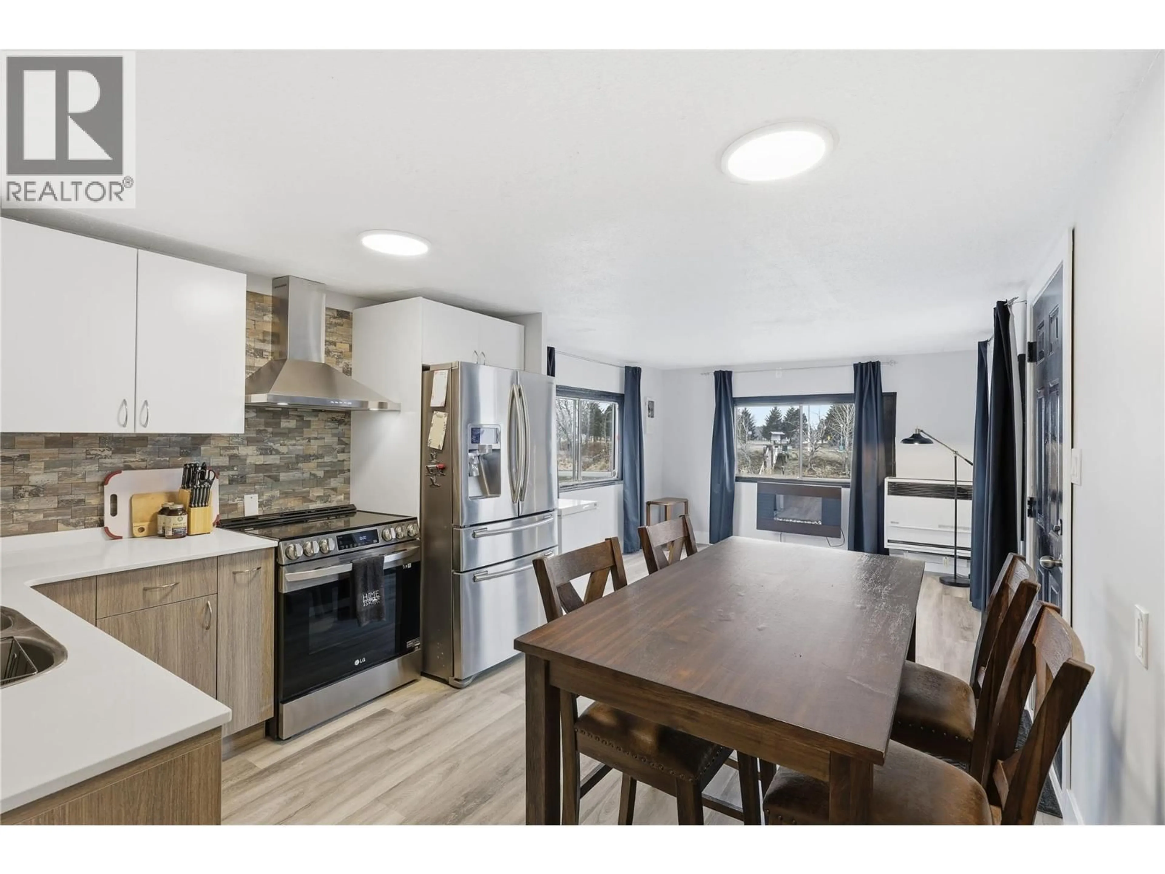 Open concept kitchen, wood/laminate floor for 41 VAN DYKE ST STREET, Kamloops British Columbia V2B4G2