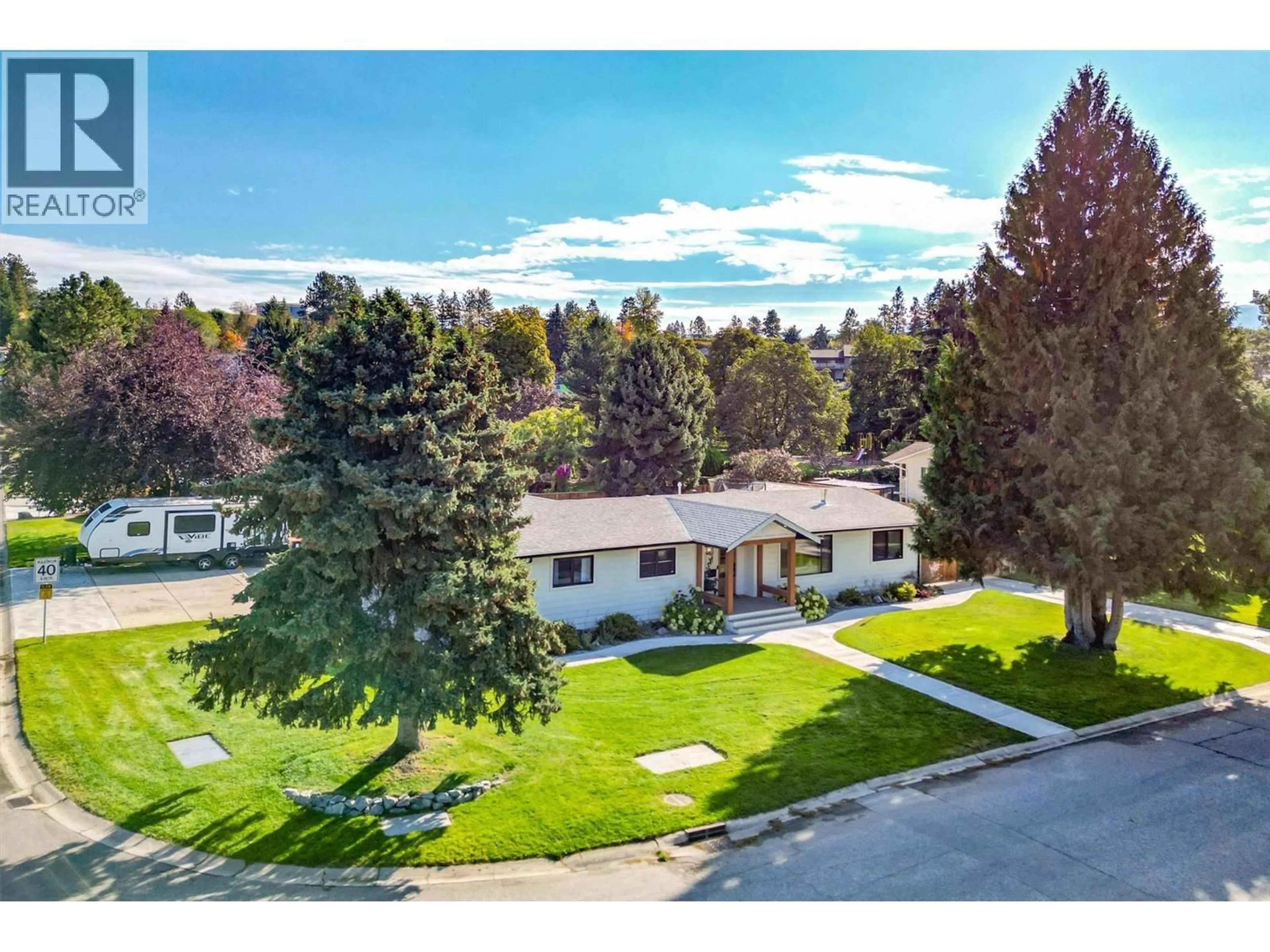 A pic from outside/outdoor area/front of a property/back of a property/a pic from drone, mountain view for 3361 HALL ROAD, Kelowna British Columbia V1W2V9