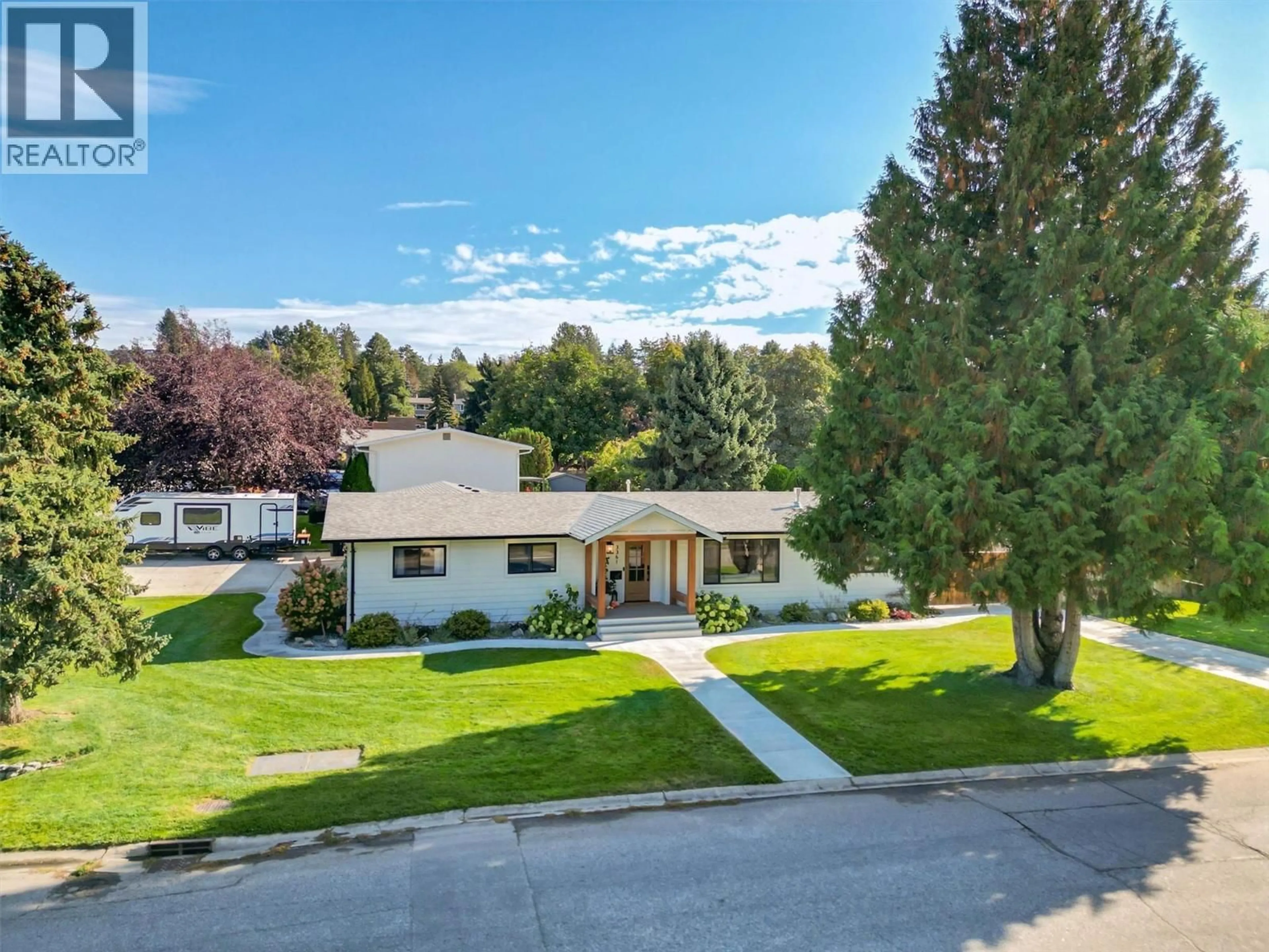 A pic from outside/outdoor area/front of a property/back of a property/a pic from drone, mountain view for 3361 HALL ROAD, Kelowna British Columbia V1W2V9