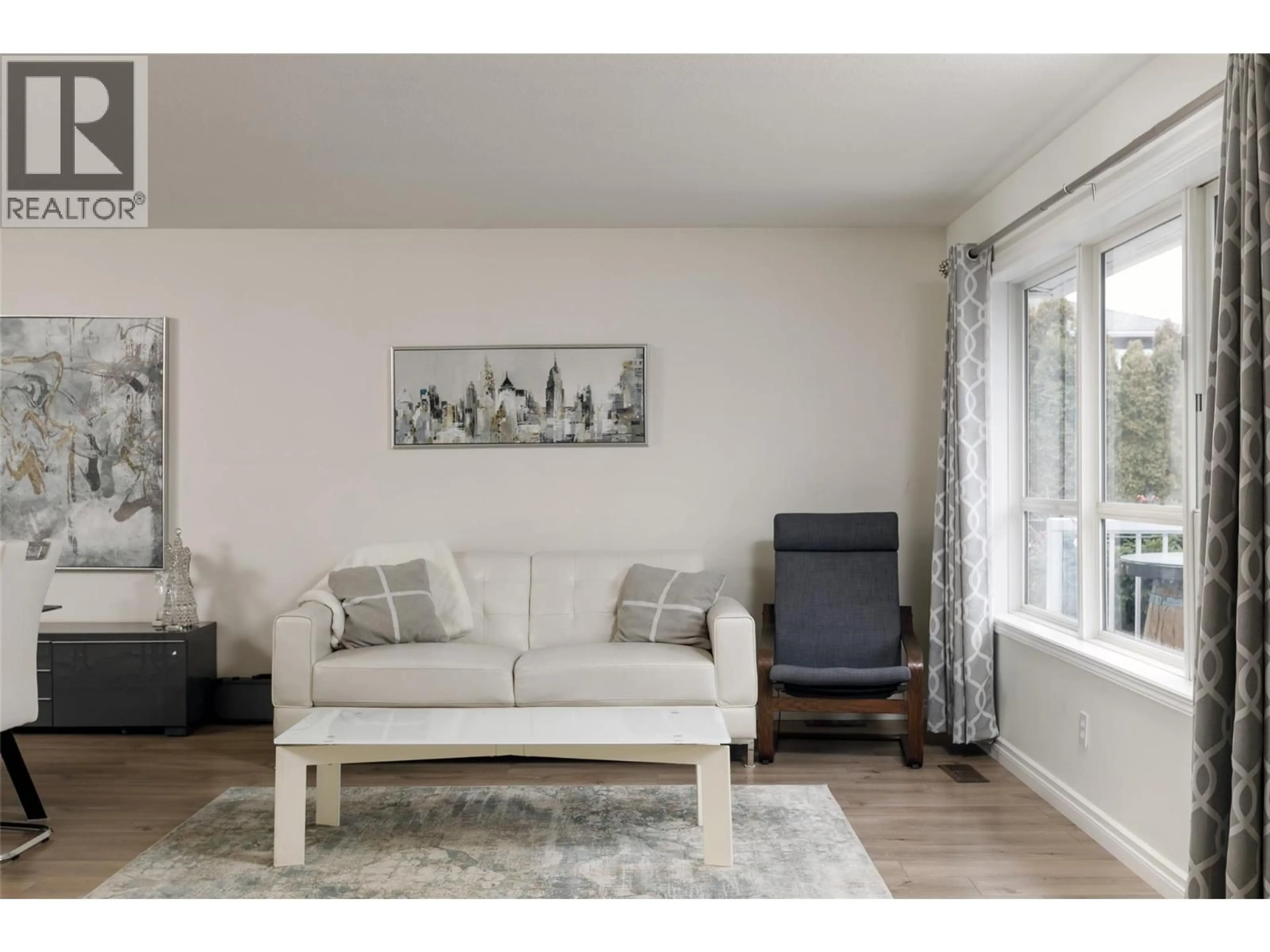 Living room with furniture, wood/laminate floor for 2611 GUIDI ROAD, West Kelowna British Columbia V1Z3J9